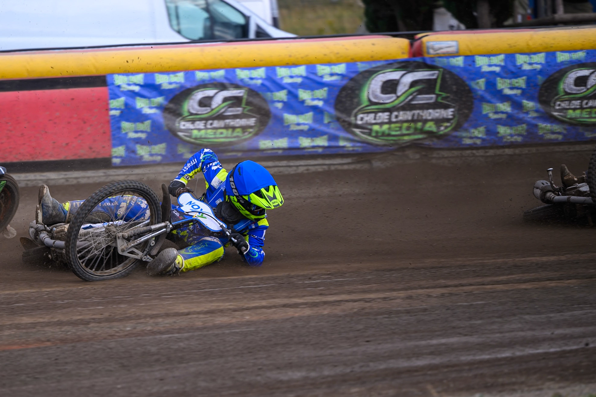 Will Boraston of Buxton Bulls in Yellow falls in the path of Ollie Binns of Kings Lynn Young Stars during the WSRA National Development League match between Buxton Bulls and King's Lynn Young Stars at Hi-Edge Speedway, Buxton on Sunday 9th August 2026. (Photo: Ian Charles | MI News)