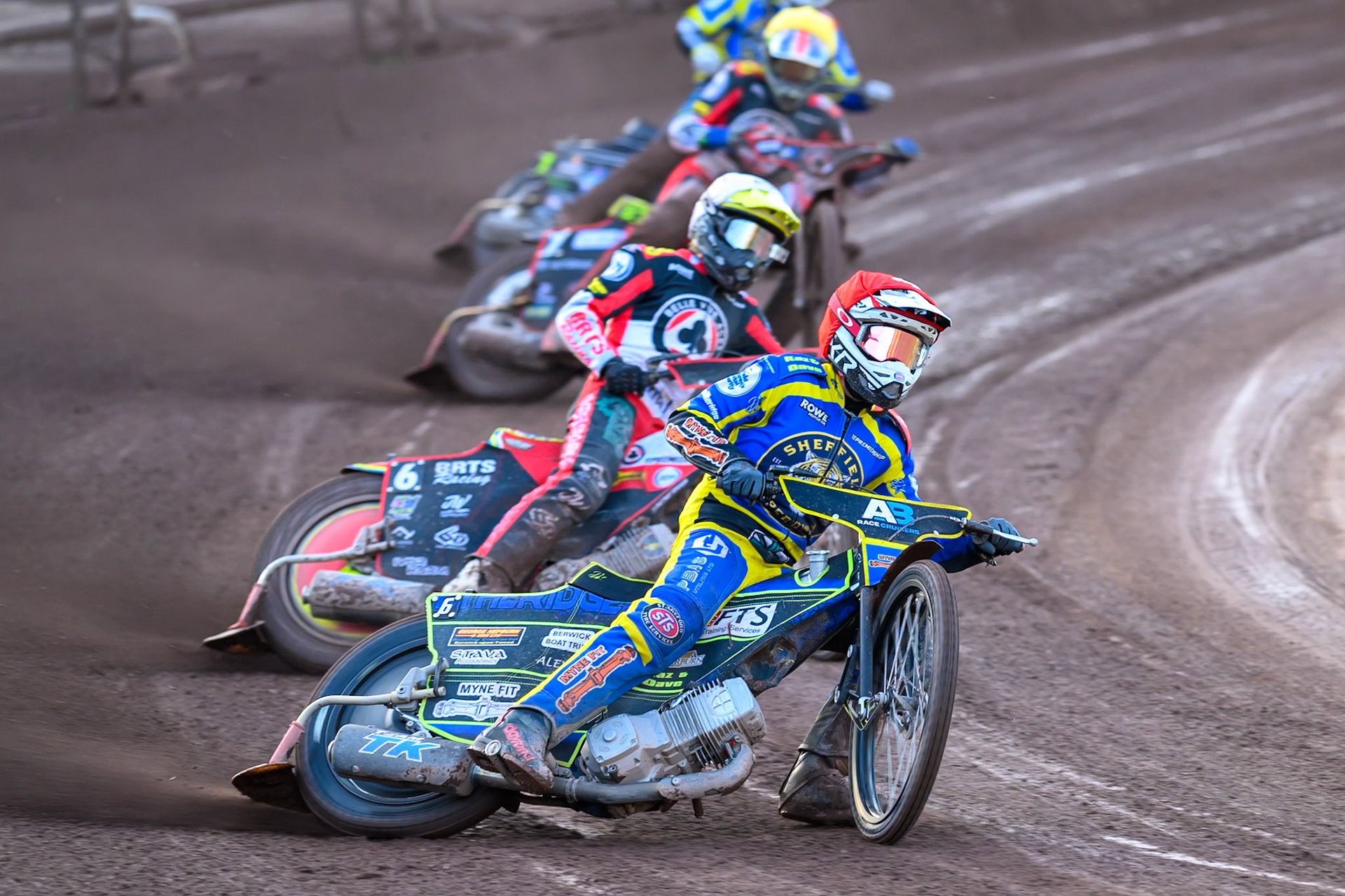 Jye Etheridge of Sheffield Tigers in Red leading Tate Zischke of Belle Vue Aces in White and Will Cairns of Belle Vue Aces in Yellow during the Rowe Motor Oil Premiership match between Sheffield Tigers and Belle Vue Aces at Owlerton Stadium, Sheffield on Monday 25th May 2026. (Photo: Ian Charles | MI News)