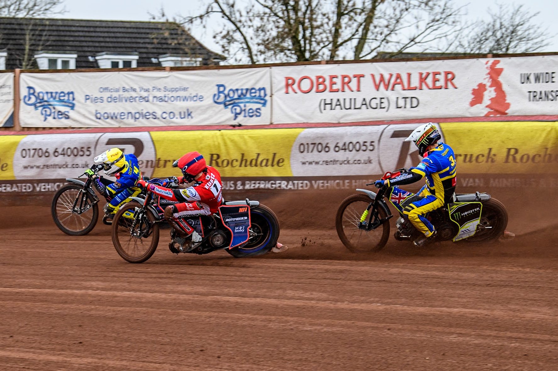 Sheffield Tigers' Josh Pickering (Yellow) leads  Belle Vue ATPI Aces Brady Kurtz (Red) and Sheffield Tigers' Chris Holder (White) during the Rowe Motor Oil Premiership KO Cup Quarter Final 1st Leg between Belle Vue Aces and Sheffield Tigers at the National Speedway Stadium, Manchester on Monday 1st April 2024. (Photo: Ian Charles | MI News)