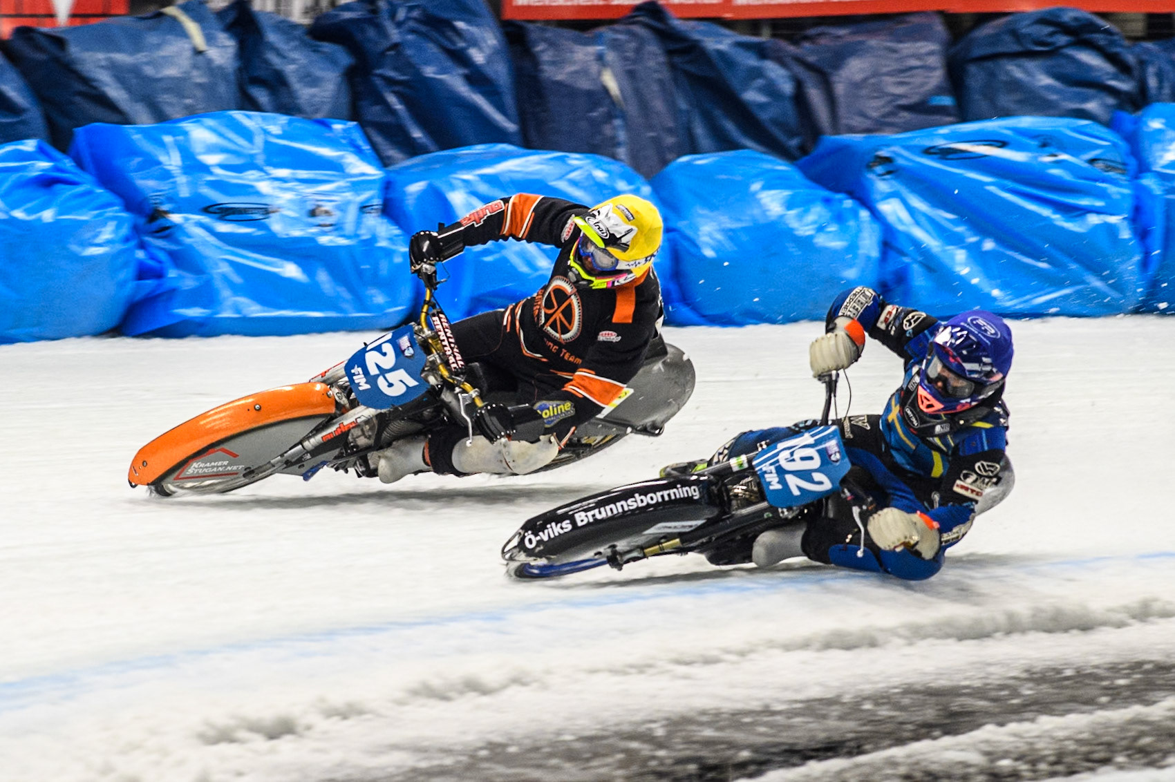 Niclas Svensson (192) of Sweden in Blue rides inside Sebastian Reitsma (125) of The Netherlands in Yellow during the Ice Speedway Gladiators World Championship Final 1 at Max-Aicher-Arena, Inzell on Saturday 15th March 2025. (Photo: Ian Charles | MI News)