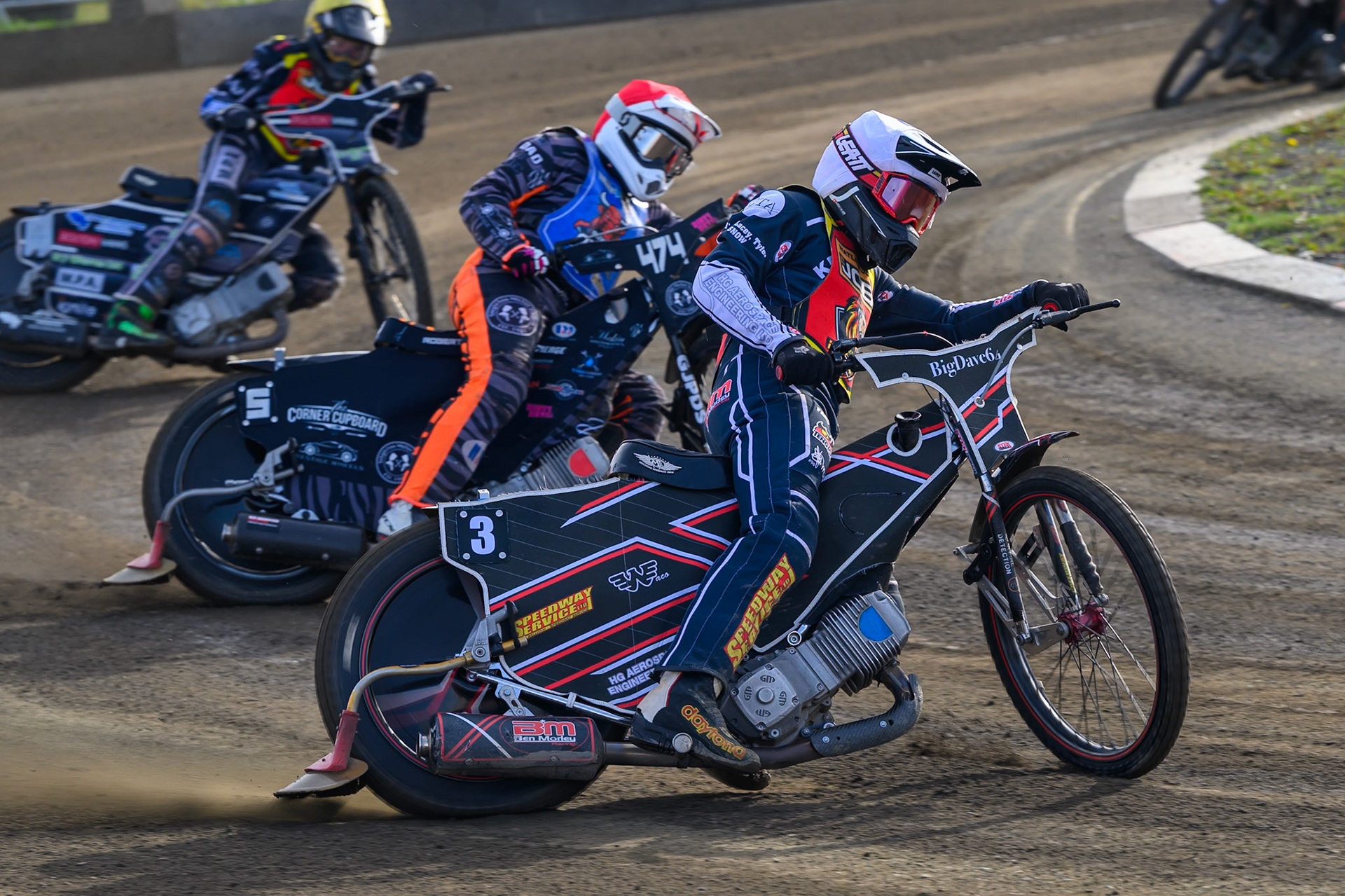 Ben Morley of Leicester Lion Cubs   in White leading Jack Roberts of Buxton Bulls   in Red and Seth Norman of Leicester Lion Cubs   in Yellow  during the WSRA National Development League match between Buxton Bulls and Leicester Lion Cubs at Hi-Edge Speedway, Buxton on Sunday 4th October 2026. (Photo: Ian Charles | MI News)