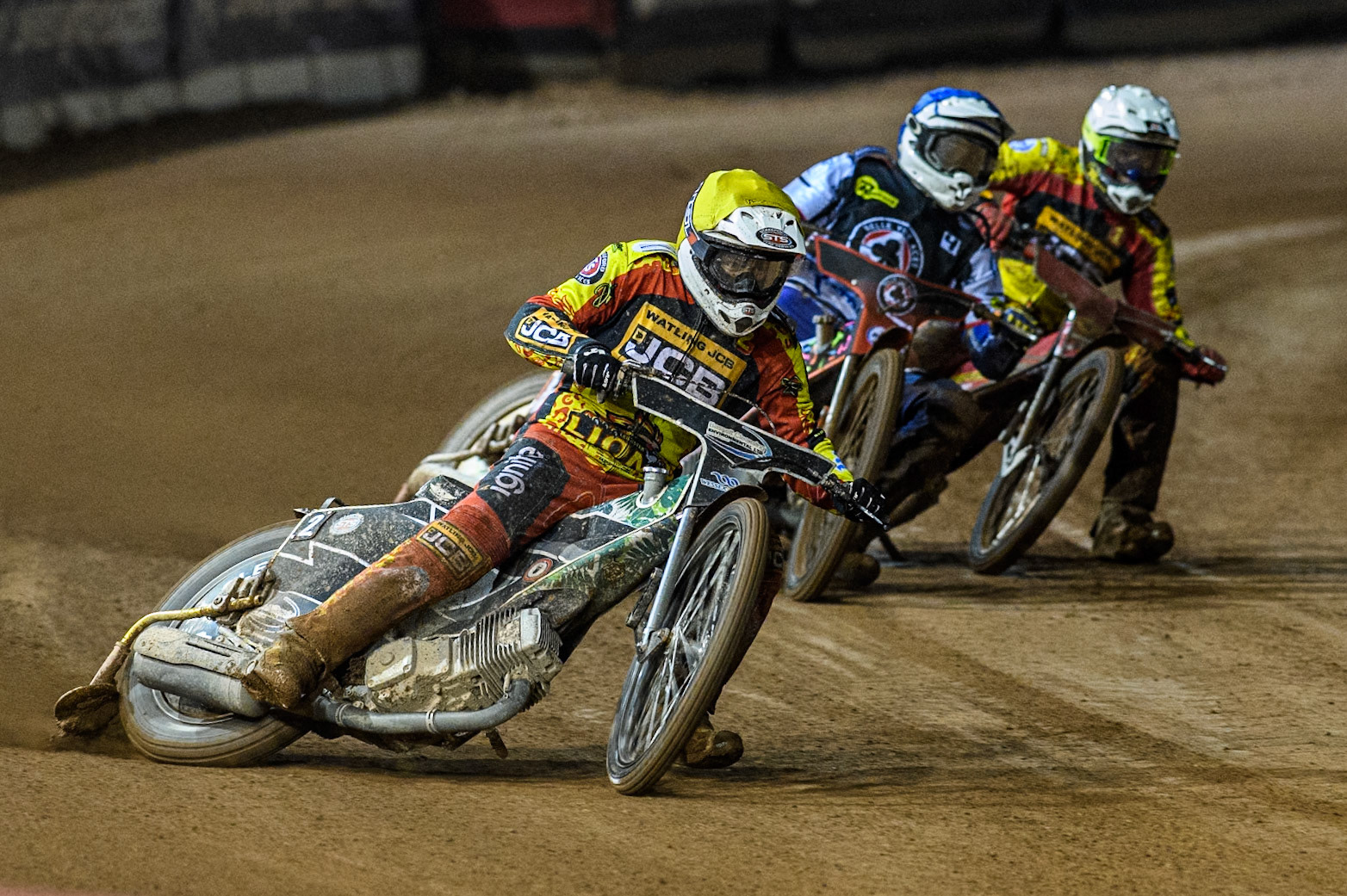 Leicester Lions' Richard Lawson  in Yellow leading Belle Vue Aces' Guest Rider Niels. K. Iversen  in Blue and Leicester Lions' Max Fricke  in White during the Rowe Motor Oil Premiership Grand Final 1st Leg between Belle Vue Aces and Leicester Lions at the National Speedway Stadium, Manchester on Monday 23rd September 2024. (Photo: Ian Charles | MI News)