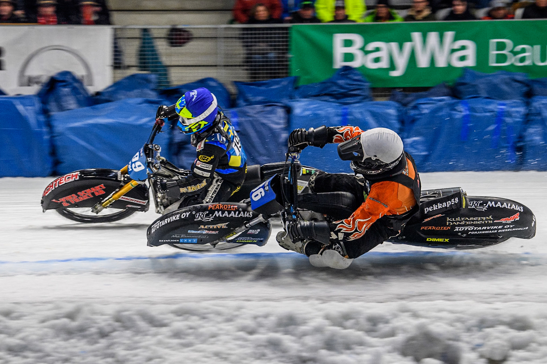 Finland's Aki Ala-Riihimäki (66) (White) inside Sweden's Martin Haarahiltunen (199)  (Blue) during the FIM Ice Speedway Gladiators World Championship Final 2 at the Max-Aicher-Arena, Inzell on Sunday 24 March 2024. (Photo: Ian Charles | MI News)