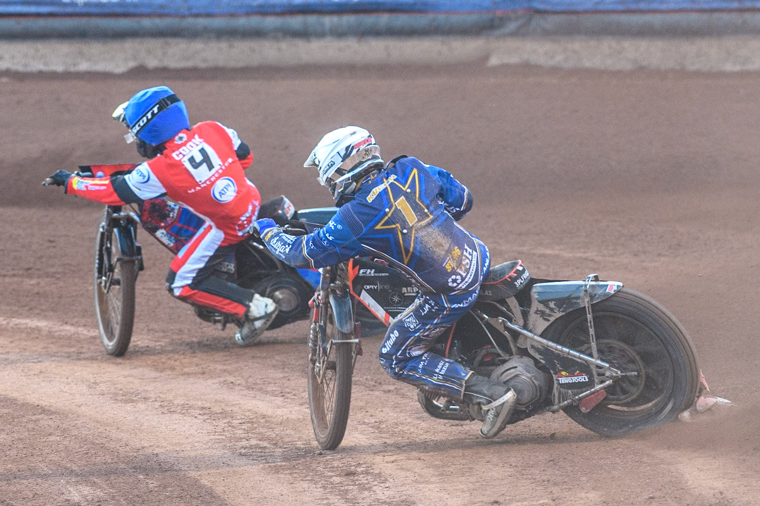 Kings Lynn Stars' Jan Kvech  in White chases Belle Vue Aces' Ben Cook  in Blue during the Rowe Motor Oil Premiership match between Belle Vue Aces and King's Lynn Stars at the National Speedway Stadium, Manchester on Monday 12th August 2024. (Photo: Ian Charles | MI News)