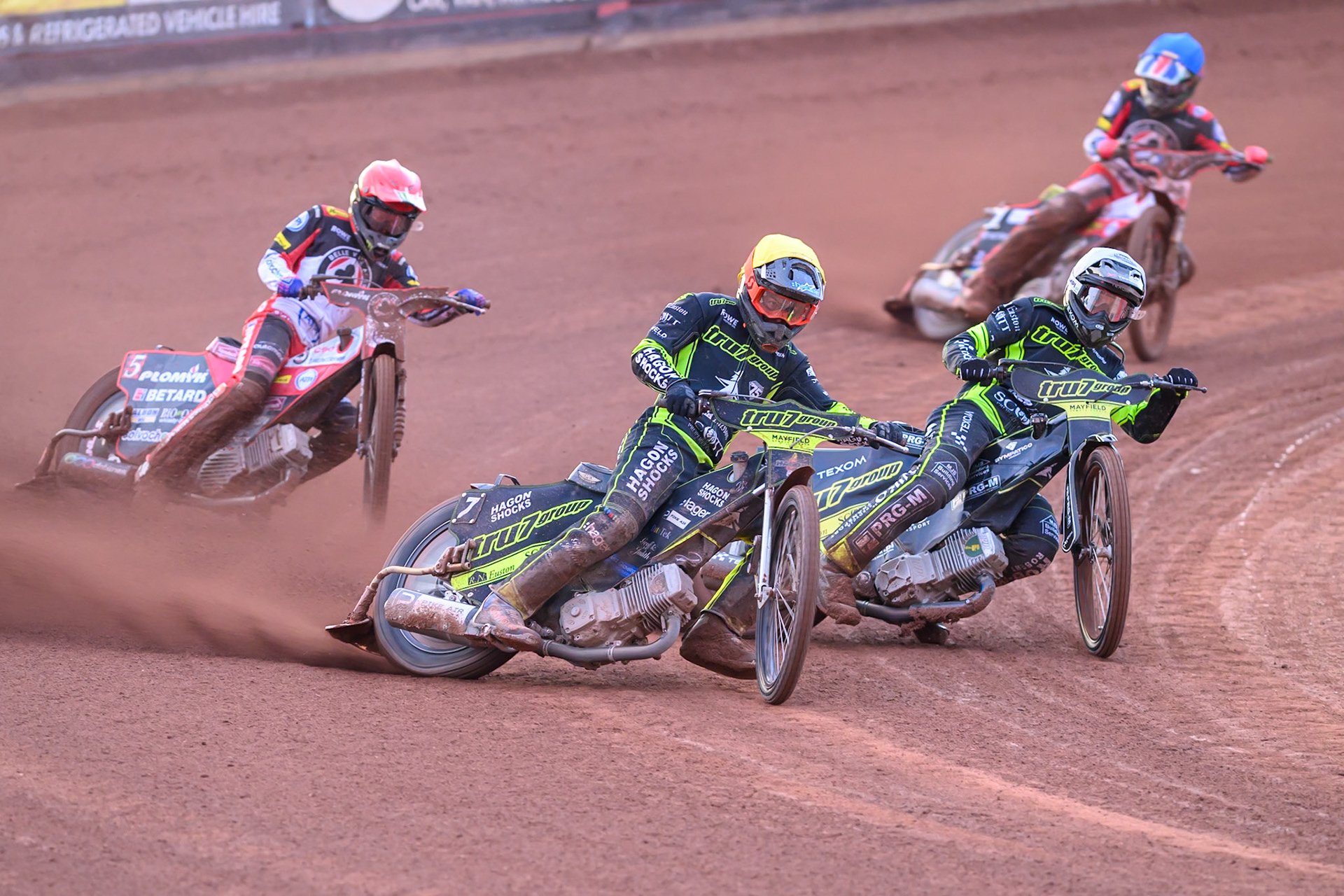 Jason Edwards of Ipswich Witches  in Yellow and Tobiasz Musielak of Ipswich Witches  in White leading Dan Bewley of Belle Vue Aces  in Red and Will Cairns of Belle Vue Aces  in Blue during the Rowe Motor Oil Premiership match between Belle Vue Aces and Ipswich Witches at the National Speedway Stadium, Manchester on Monday 20th April 2026. (Photo: Ian Charles | MI News)
