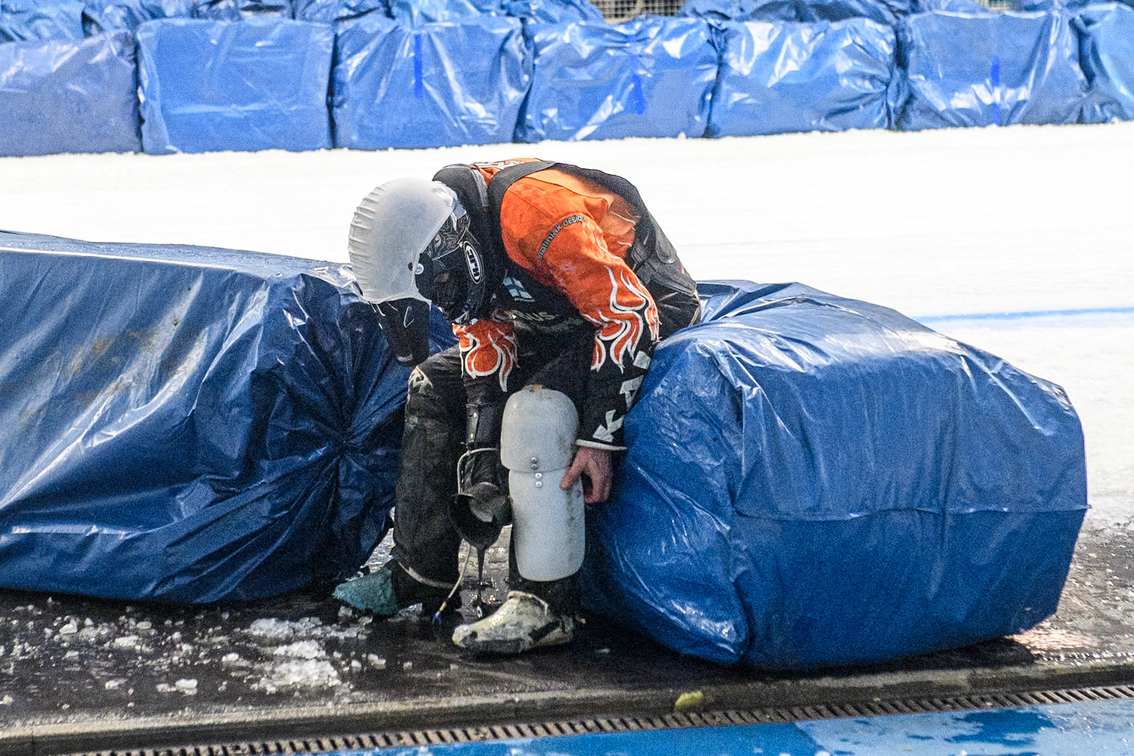 Finland's Aki Ala-Riihimäki (66) adjusts his leg protector after his fall during the FIM Ice Speedway Gladiators World Championship Final 2 at the Max-Aicher-Arena, Inzell on Sunday 24 March 2024. (Photo: Ian Charles | MI News)