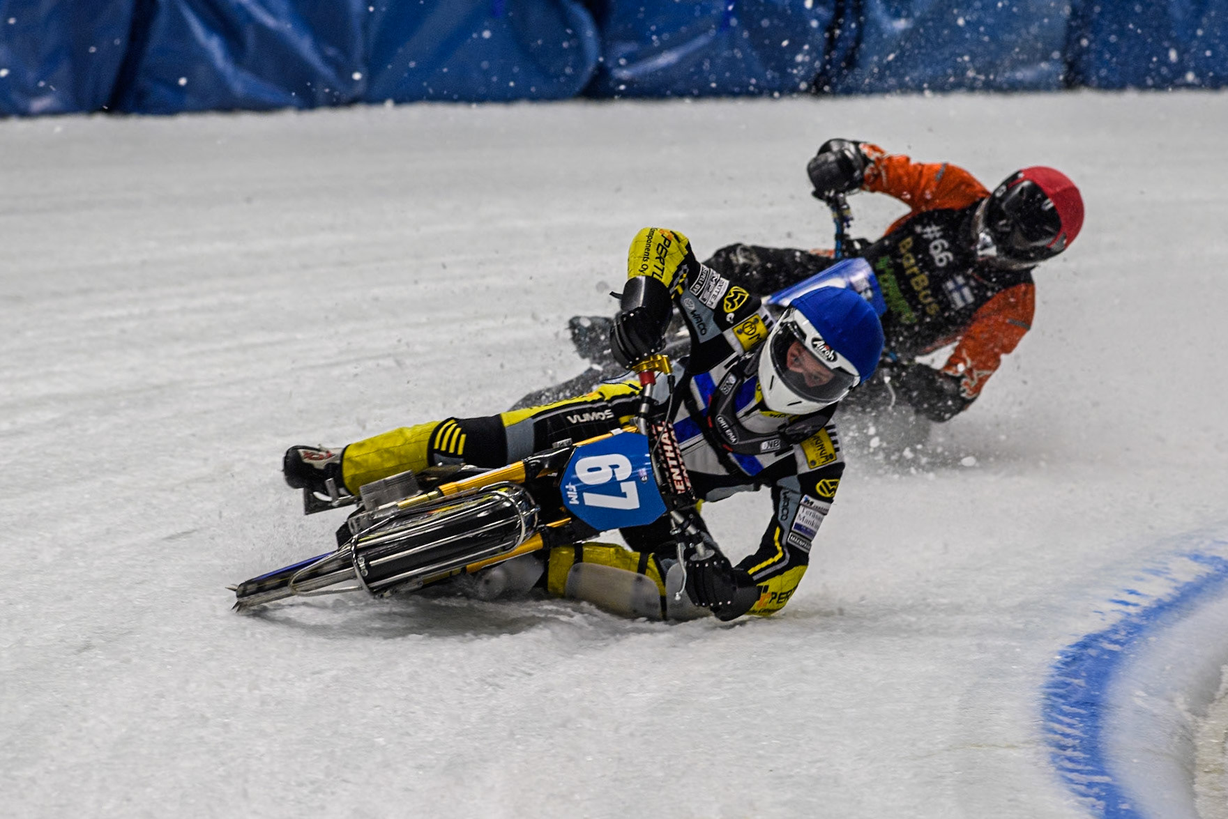 Finland's Heikki Huusko (67) (Blue) leads  Finland's Aki Ala-Riihimäki (66) (Red) during the FIM Ice Speedway Gladiators World Championship Final 1 at the Max-Aicher-Arena, Inzell on Saturday 23 March 2024. (Photo: Ian Charles | MI News)