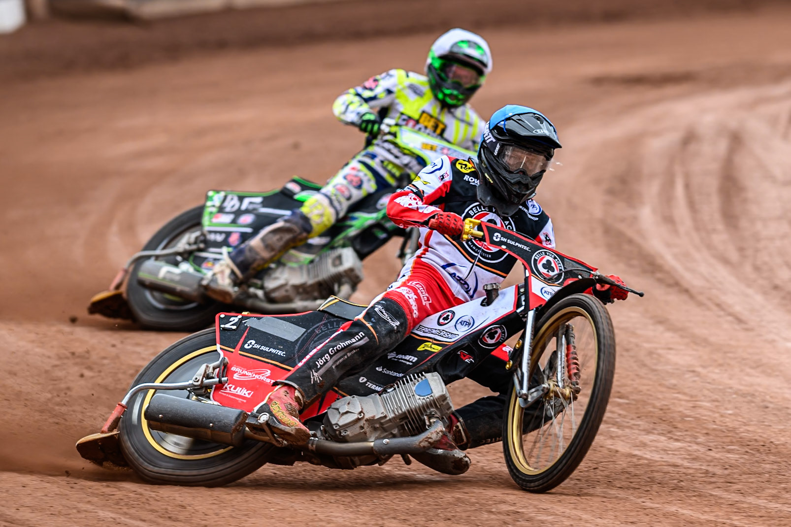 Belle Vue Aces' Norick Blödorn in Blue leading Oxford Spires' Charles Wright in White during the Rowe Motor Oil Premiership match between Belle Vue Aces and Oxford Spires at the National Speedway Stadium, Manchester on Monday 26th May 2025. (Photo: Ian Charles | MI News)