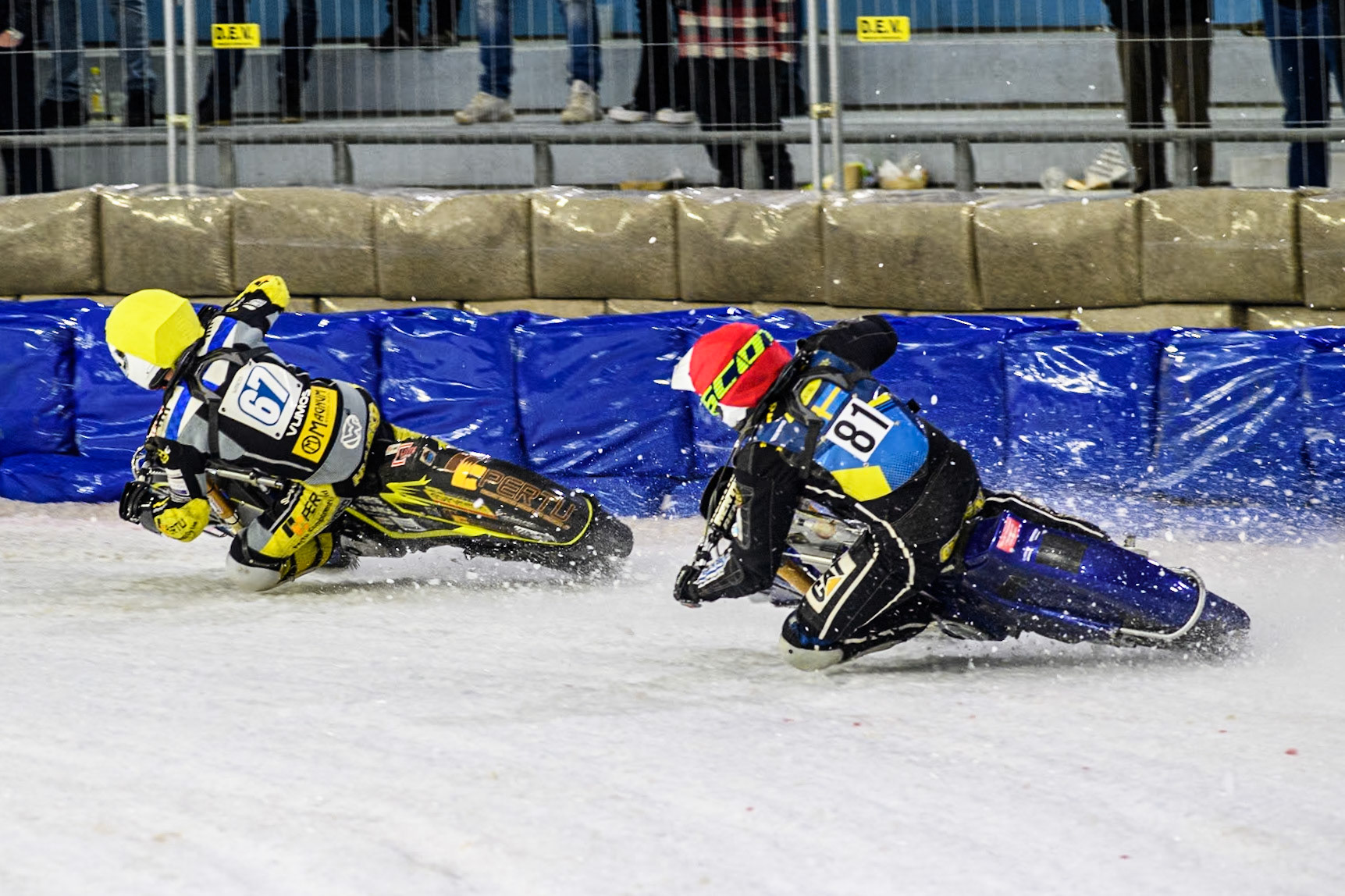 Finland's Heikki Huusko (67) in Yellow leading Sweden"s Jimmy Olsén (81) in Red during the FIM Ice Speedway Gladiators World Championship Final 4 at Ice Rink Thialf, Heerenveen on Sunday 7th April 2024. (Photo: Ian Charles | MI News)