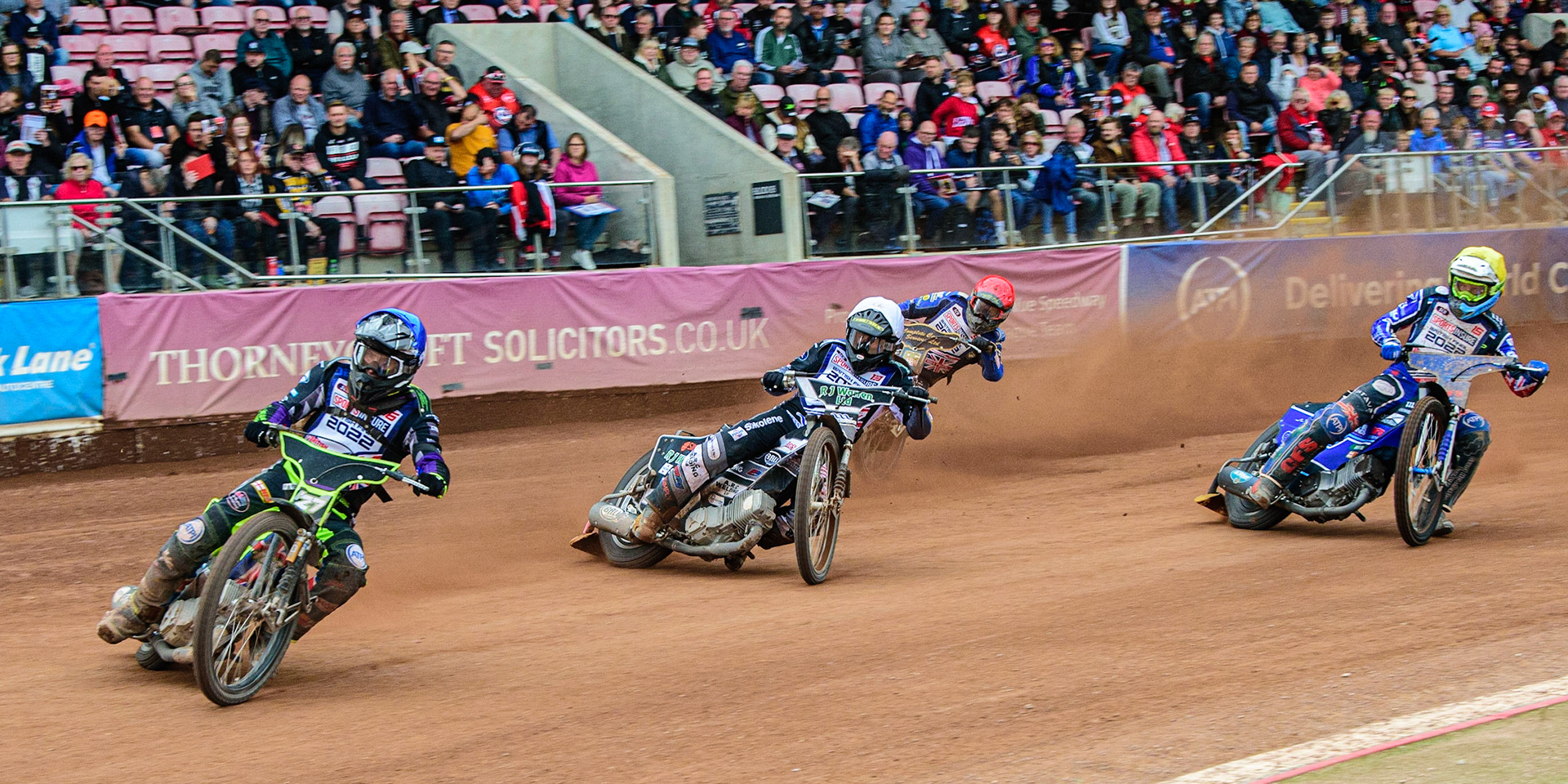 Tom Brennan  (Blue) leads the semi final from Danny King  (White), Kyle Howarth  (Red) and Adam Ellis  (Yellow) during the Sports Insure British Speedway Final, at the National Speedway Stadium, Manchester, on Sunday 18th September 2022. (Credit: Ian Charles | MI News )