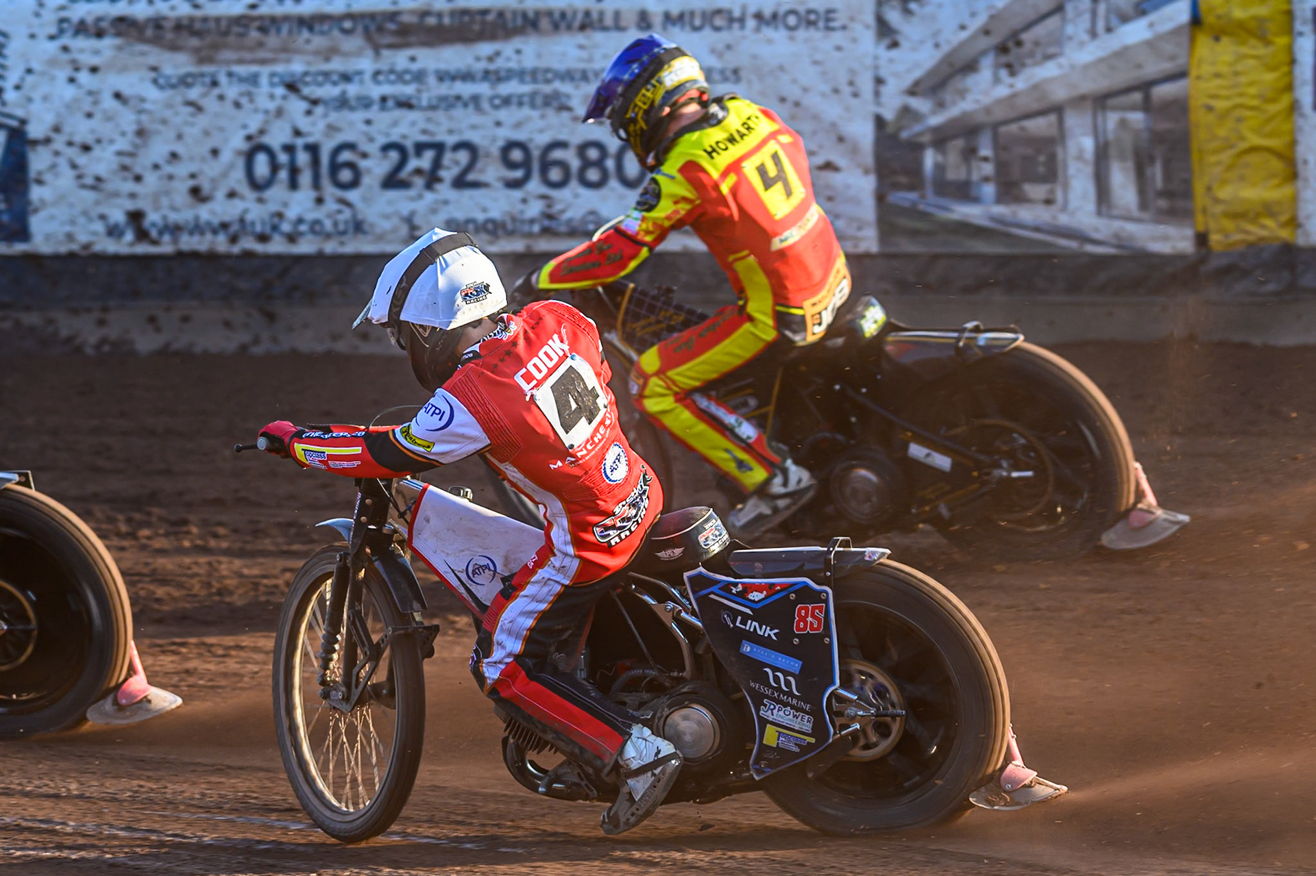 Belle Vue Aces' Zach Cook rides inside Leicester Lions' Kyle Howarth in Blue during the Rowe Motor Oil Premiership match between Leicester Lions and Belle Vue Aces at the Hydroscand Arena, Leicester on Thursday 19th June 2025. (Photo: Ian Charles | MI News)