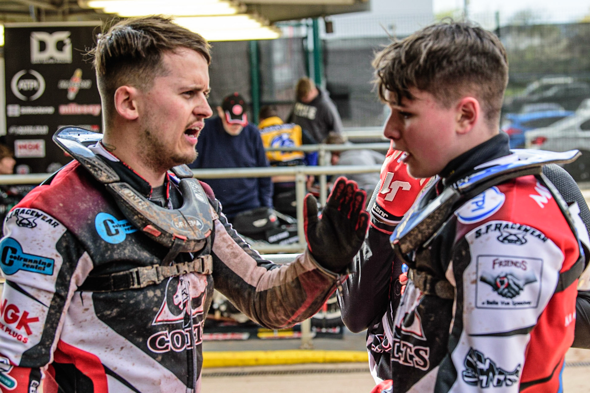MANCHESTER, UK. APR 15TH   Jack Smith  (left) chats with Sam McGurk in the pits during the National Development League match between Belle Vue Colts and Plymouth Centurions at the National Speedway Stadium, Manchester on Friday 15th April 2022. (Credit: Ian Charles | MI News)