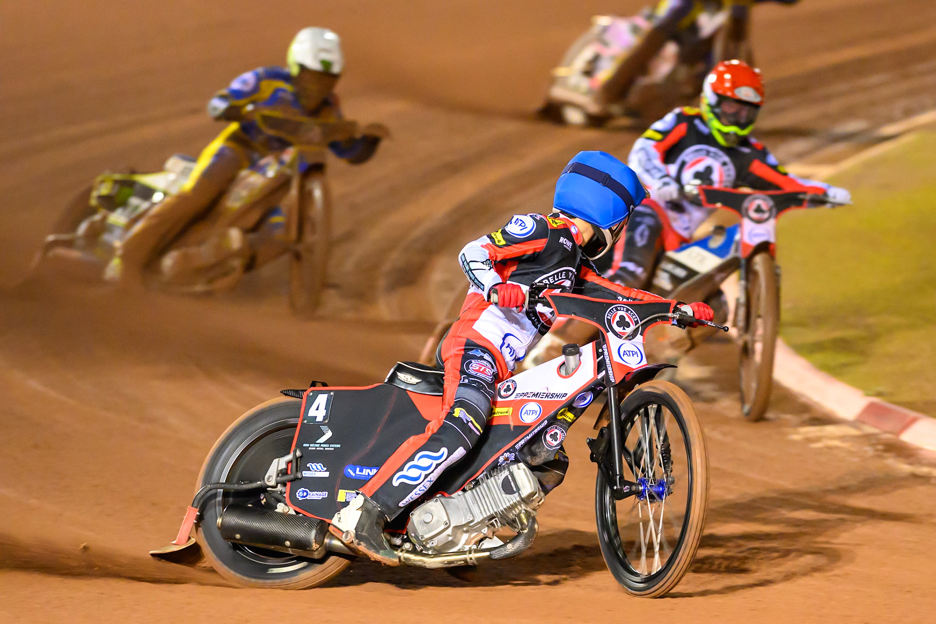 Zach Cook of Belle Vue Aces in Blue looks for team mate Nicolai Klindt, Guest Rider for Belle Vue Aces in Red  whilst leading Chris Holder of Sheffield Tigers in White during the Rowe Motor Oil Premiership Grand Final 2nd Leg between Belle Vue Aces and Sheffield Tigers at the National Speedway Stadium, Manchester on Friday 16th October 2026. (Photo: Ian Charles | MI News)