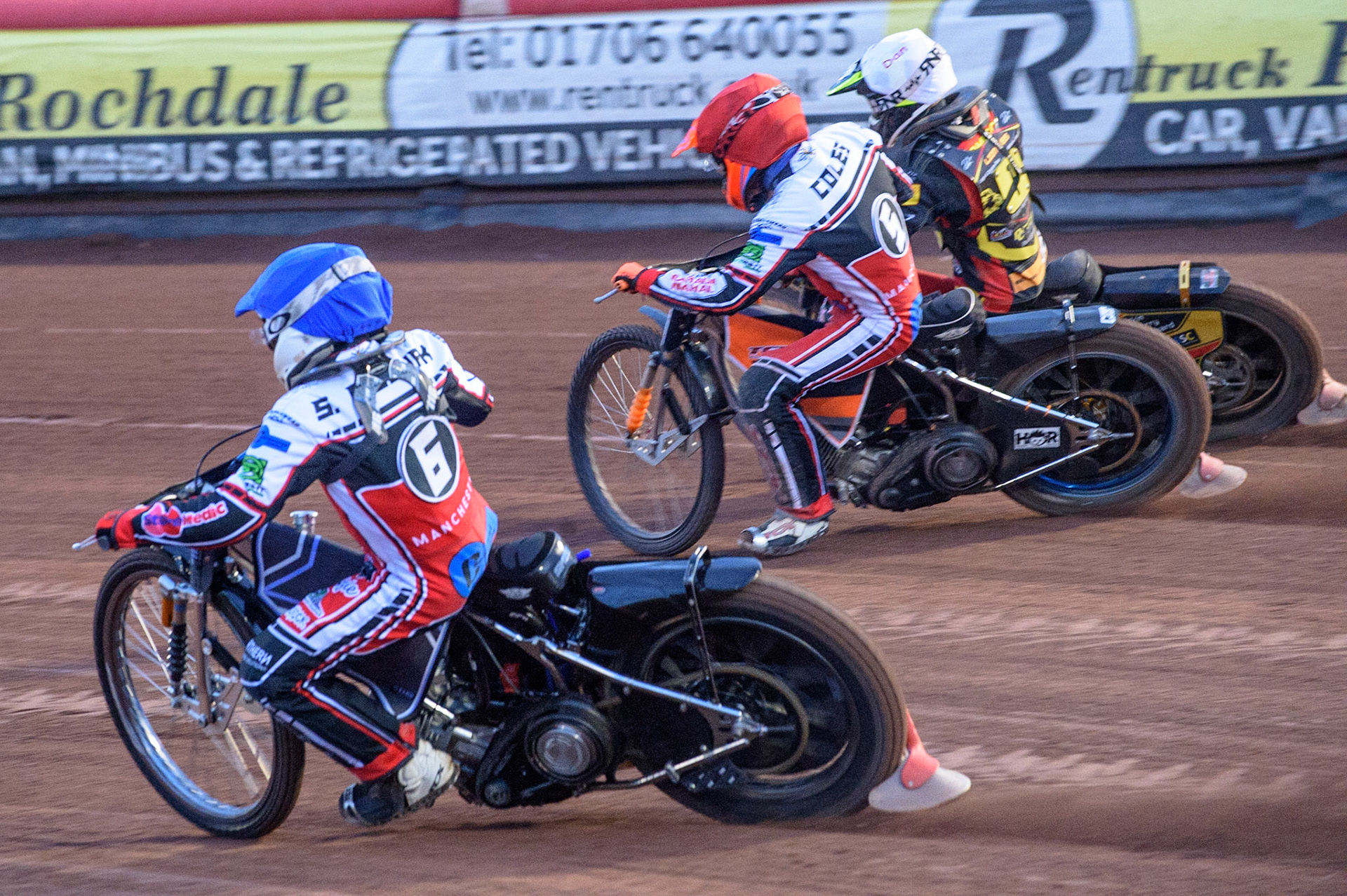 MANCHESTER, UK. JULY 29TH    Sam McGurk  (Blue) passes Connor Coles  (Red) and Dan Thompson (Yellow) during the National Development League match between Belle Vue Colts and Leicester Lion Cubs at the National Speedway Stadium, Manchester on Thursday 29th July 2021. (Credit: Ian Charles | MI News)