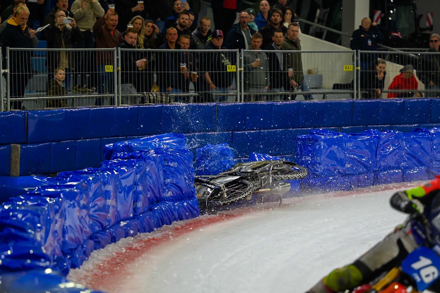 Heikki Huusko (67) of Finland  collides with Wild Card Harald Simon (16) of Austria in Yellow in the first turn during the FIM Ice Speedway Gladiators World Championship Final 3 at Ice Rink Thialf, Heerenveen on Saturday 11th April 2026. (Photo: Ian Charles | MI News)