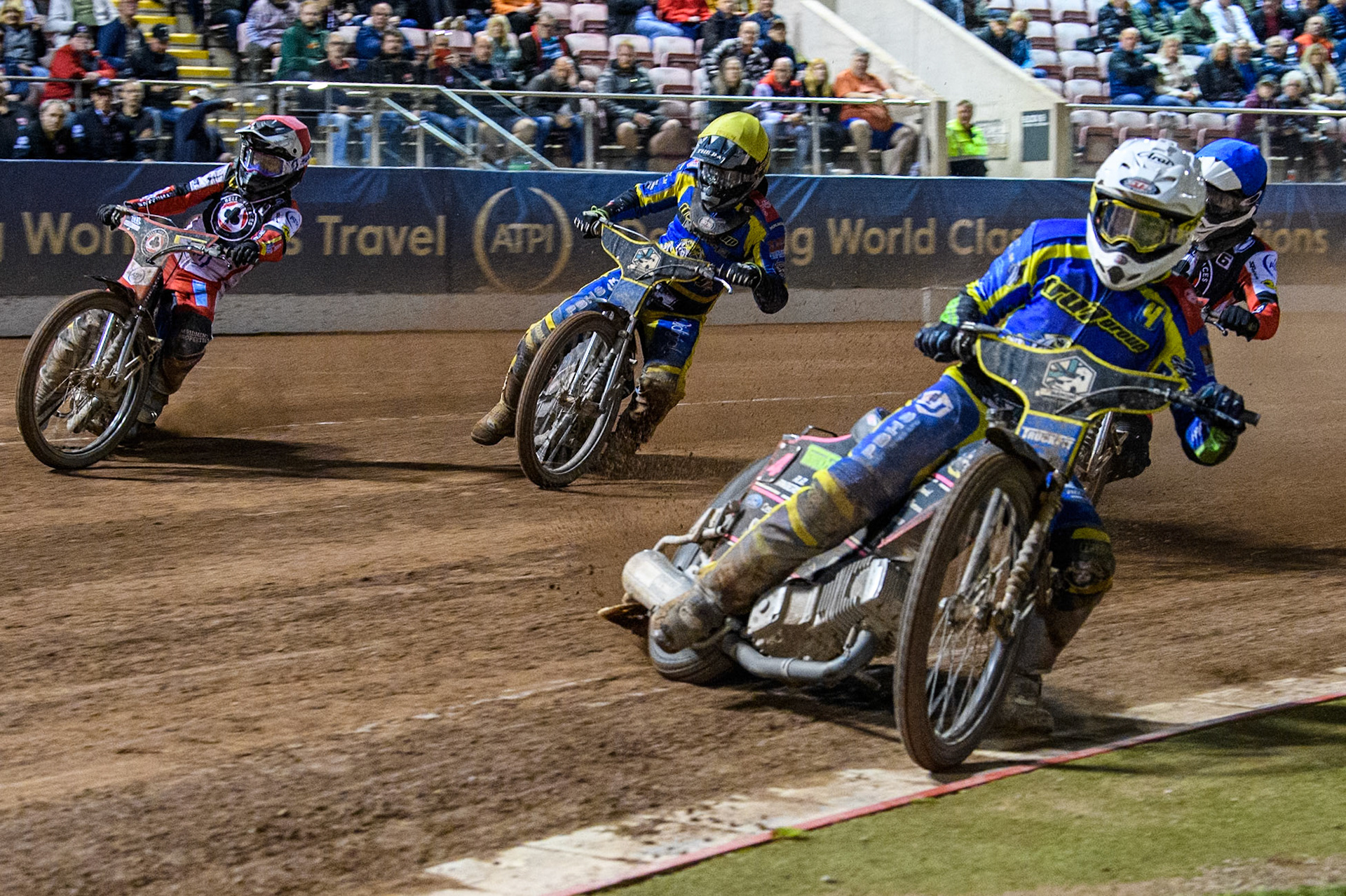 Sheffield Tigers' Josh Pickering  in White leading Belle Vue Aces' Ben Cook  in Red, Sheffield Tigers' Dan Gilkes  in Yellow and Belle Vue Aces' Antti Vuolas  in Blue during the Rowe Motor Oil Premiership Play Off Semi Final 2, 1st Leg match between Belle Vue Aces and Sheffield Tigers at the National Speedway Stadium, Manchester on Monday 16th September 2024. (Photo: Ian Charles | MI News)