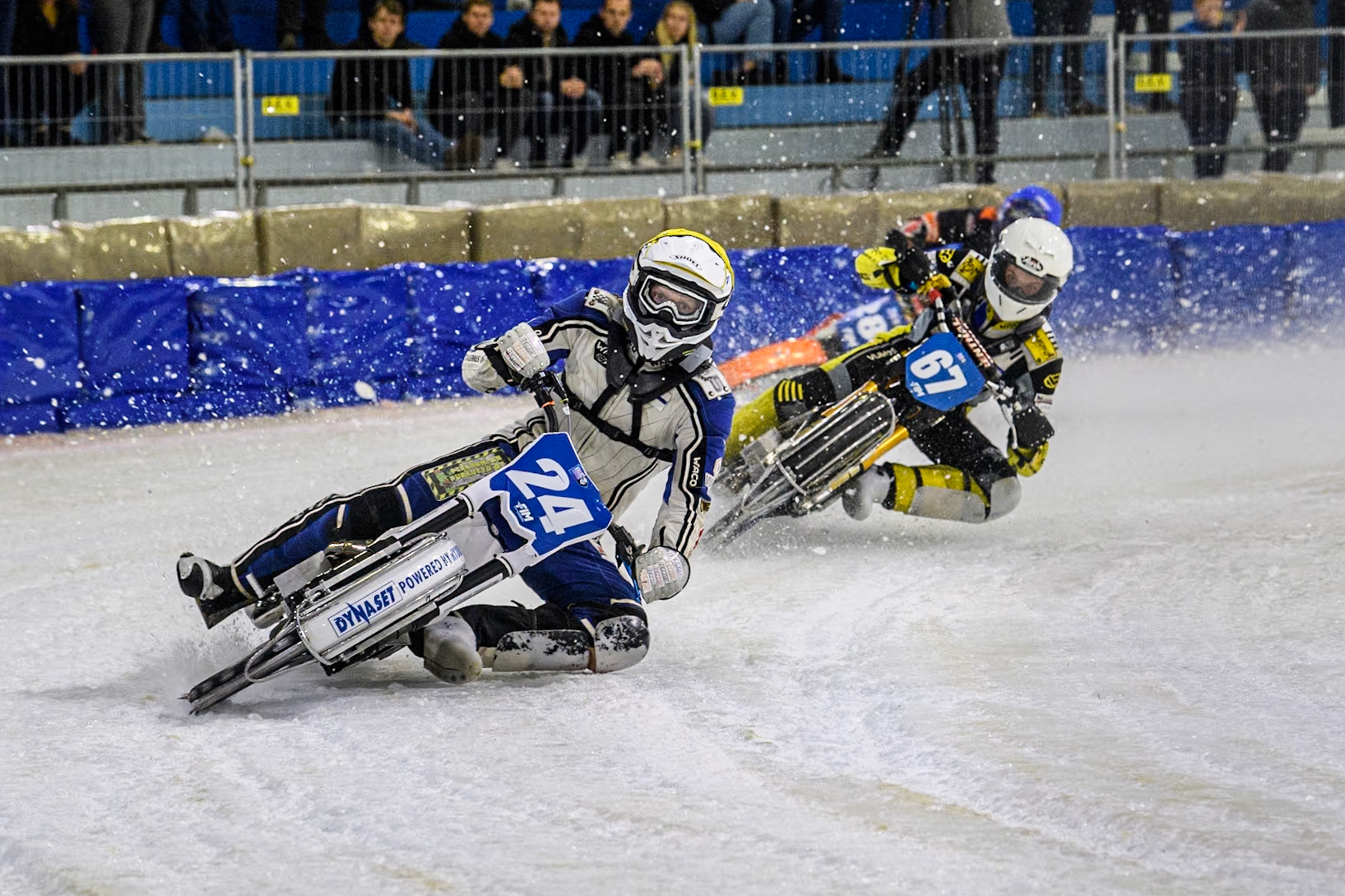 Finland's Max Koivula (24) in Yellow leading Finland's Heikki Huusko (67) in White and Netherland's Sebastian Reitsma (283) in Blue  during the FIM Ice Speedway Gladiators World Championship Final 4 at Ice Rink Thialf, Heerenveen on Sunday 7th April 2024. (Photo: Ian Charles | MI News)