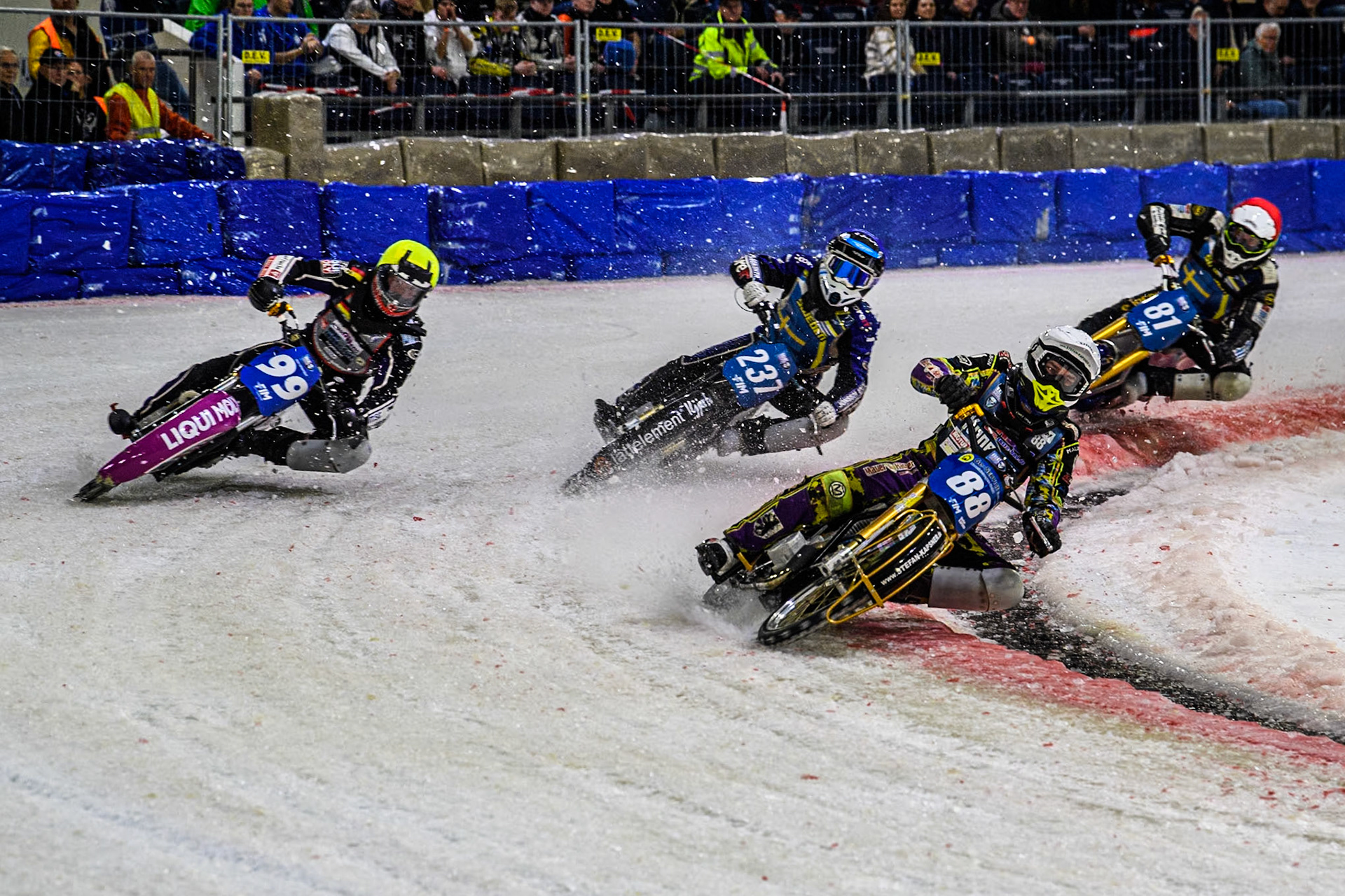 Germany's Max Niedermaier (88) in White leading Germany's Benedikt Monn (99) in Yellow, Sweden's Jimmy Hörnell Lidfalk (237) in Blue and Sweden"s Jimmy Olsén (81) in Red during the FIM Ice Speedway Gladiators World Championship Final 3 at Ice Rink Thialf, Heerenveen on Saturday 6th April 2024. (Photo: Ian Charles | MI News)