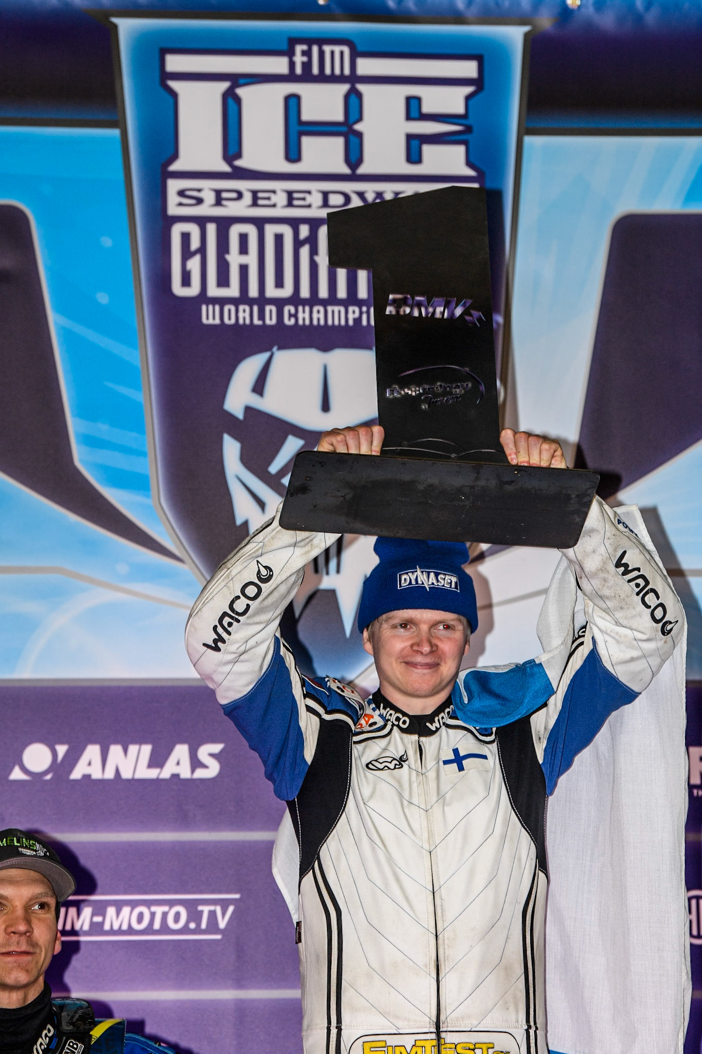 Max Koivula (24) of Finland holds up the winners trophy during the Ice Speedway Gladiators World Championship Final 1 at Max-Aicher-Arena, Inzell on Saturday 15th March 2025. (Photo: Ian Charles | MI News)