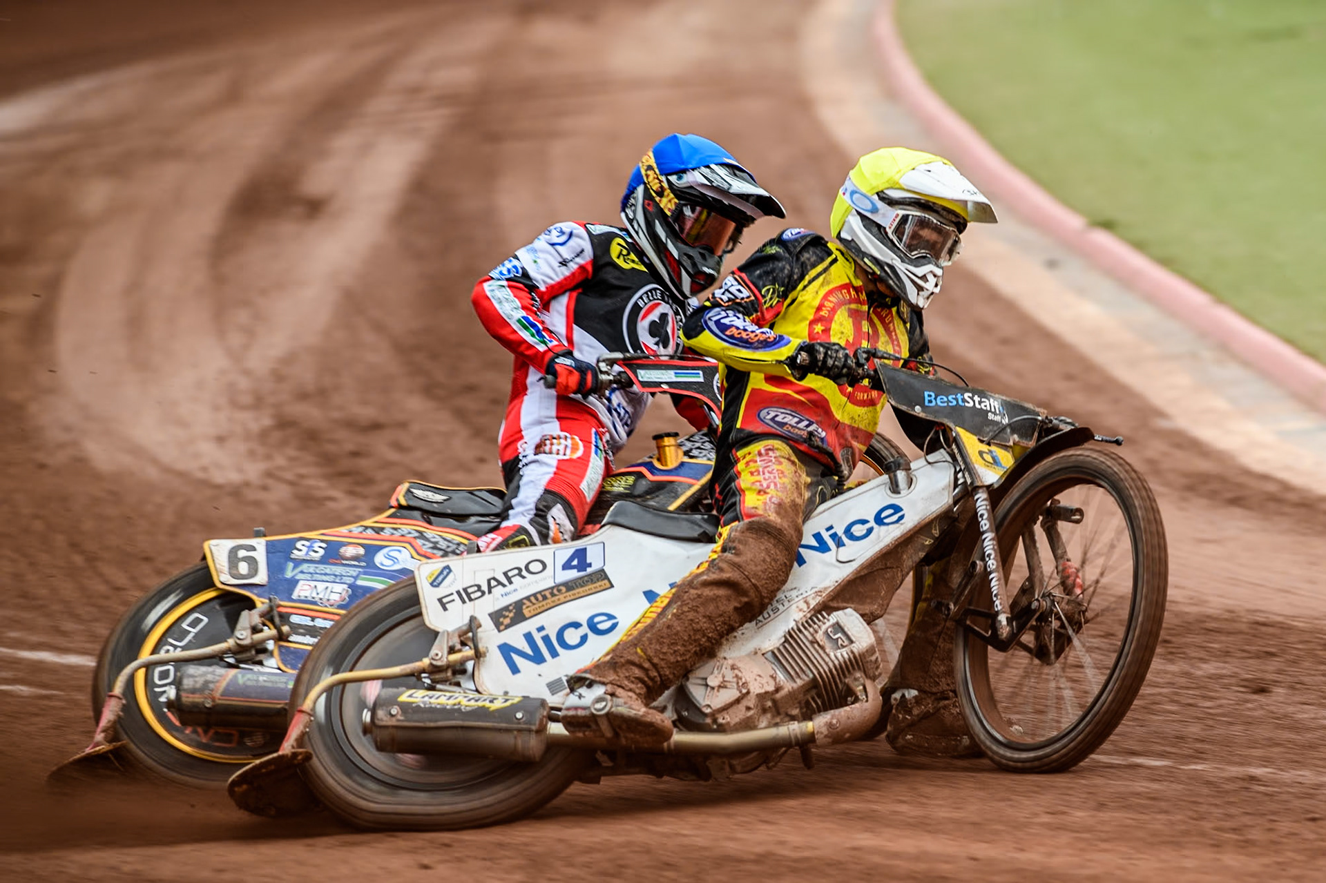 Birmingham Brummies' Wiktor Lampart  in Yellow rides outside Belle Vue Aces' Connor Mountain  in Blue during the Rowe Motor Oil Premiership match between Belle Vue Aces and Birmingham Brummies at the National Speedway Stadium, Manchester on Monday 6th May 2024. (Photo: Ian Charles | MI News)