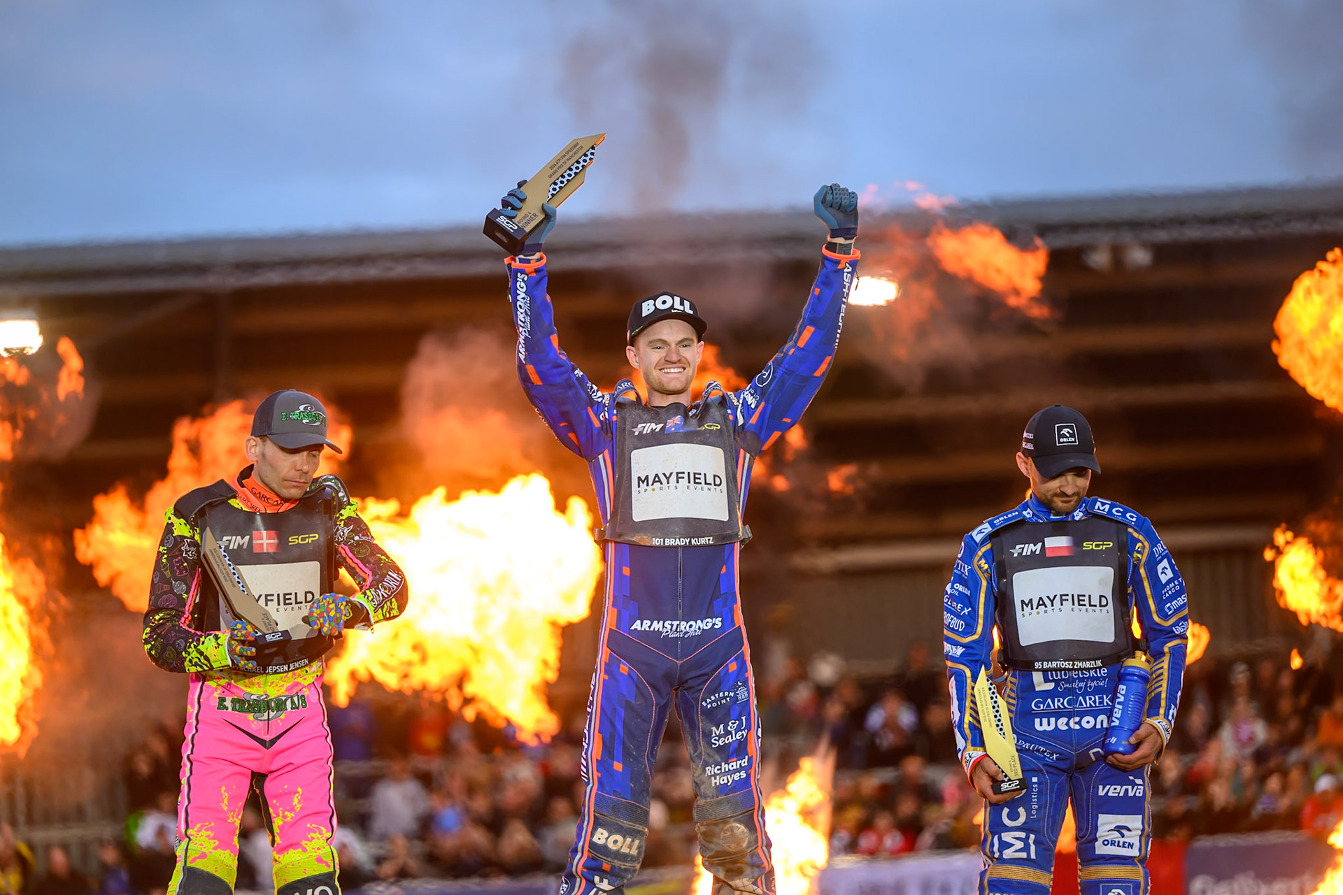 Brady Kurtz (101) of Australia (Centre) celebrates his win in the Final with Michael Jepsen Jensen (52) of Denmark (Left) and Bartosz Zmarzlik (95) of Poland (Right) during the ATPI  FIM Speedway GP of Manchester at the National Speedway Stadium, Manchester on Saturday 6th June 2026. (Photo: Ian Charles | MI News)