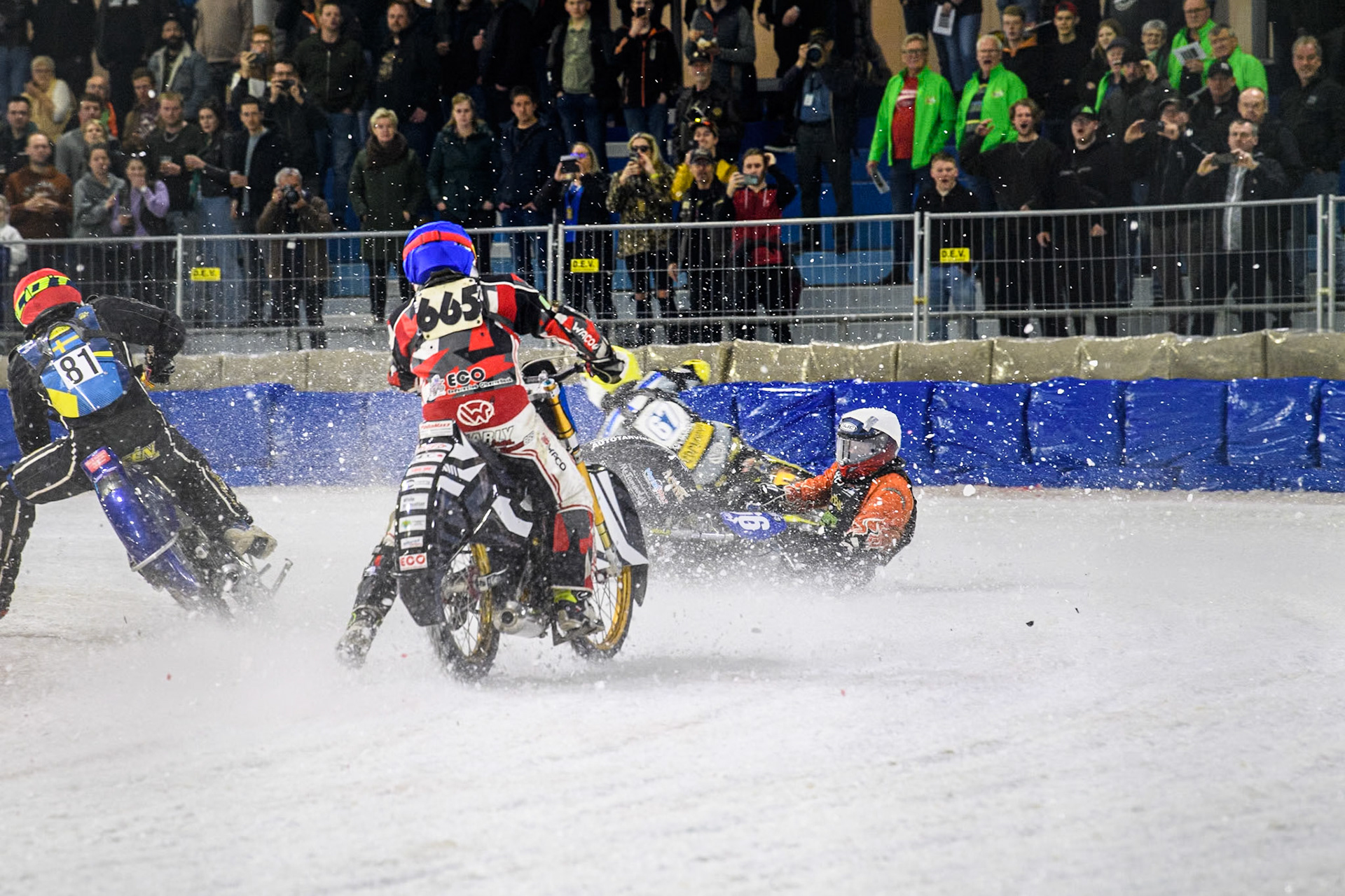 Finland's Aki Ala-Riihimäki (66) in White spins off leaving Austria's Charly Ebner (665) in Blue with nowhere to go during the FIM Ice Speedway Gladiators World Championship Final 4 at Ice Rink Thialf, Heerenveen on Sunday 7th April 2024. (Photo: Ian Charles | MI News)