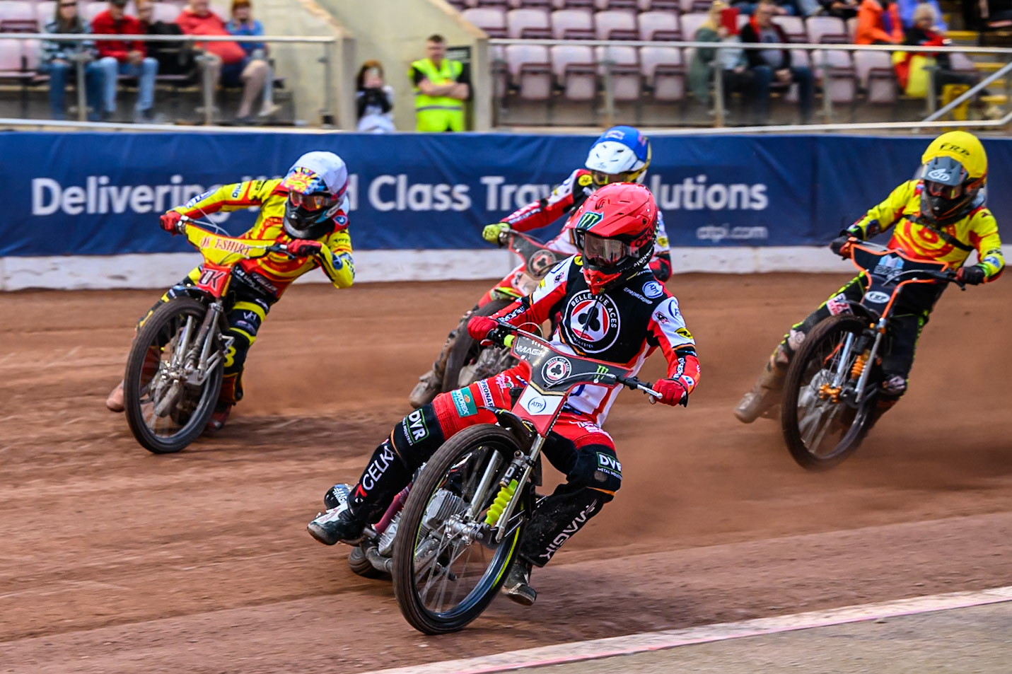 Belle Vue Aces' Jaimon Lidsey  in Red leading Birmingham Brummies' Jonas Jeppesen  in White Belle Vue Aces' Tate Zischke  in Blue and Birmingham Brummies' Guest Rider Jack Smith in Yellow during the Rowe Motor Oil Premiership match between Belle Vue Ac es and Birmingham Brummies at the National Speedway Stadium, Manchester on Monday 7th July 2025. (Photo: Ian Charles | MI News)