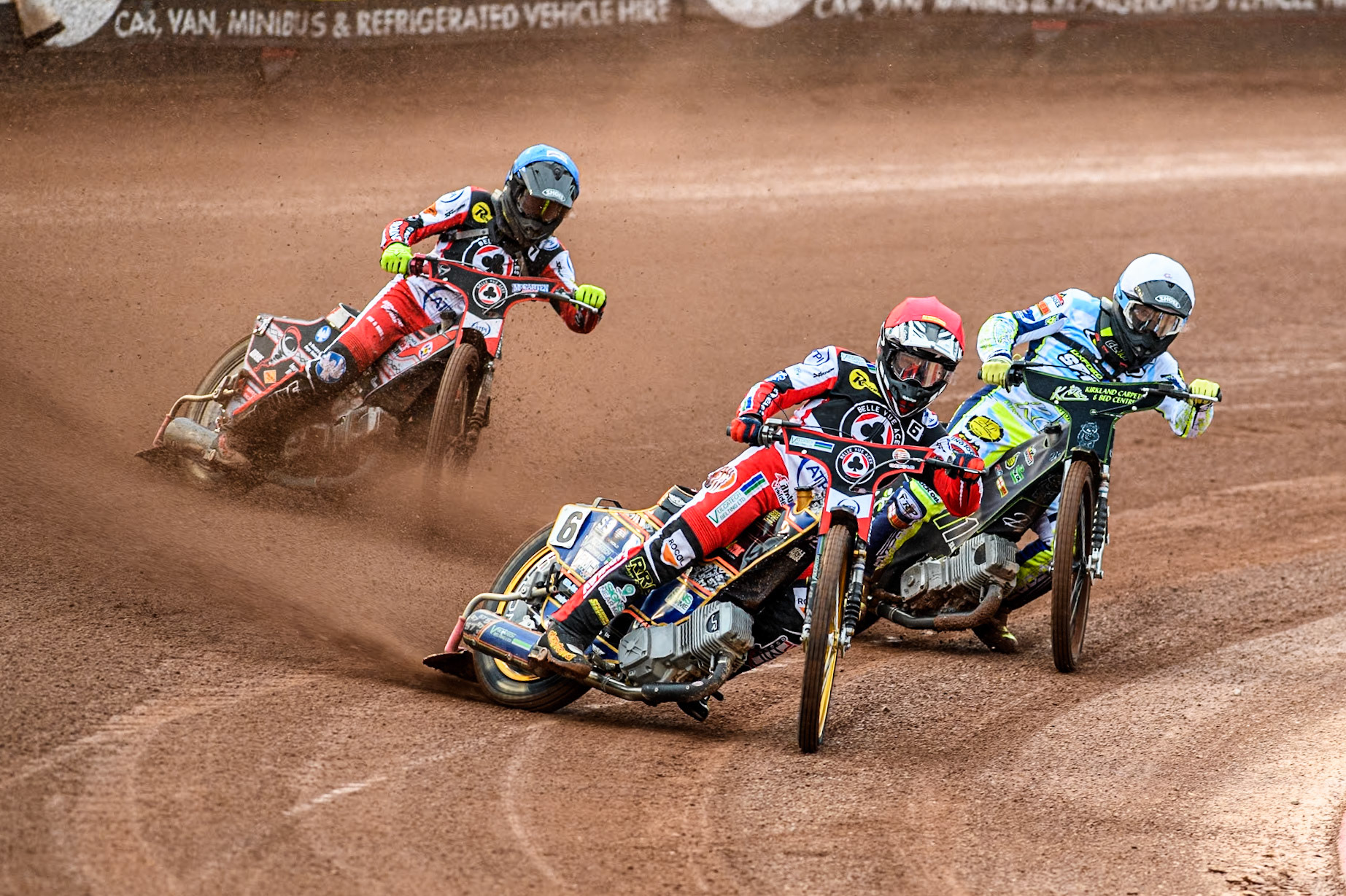 Belle Vue Aces' Connor Mountain in Red leading Oxford Spires' Craig Cook in White and Belle Vue Aces' Connor Bailey in Blue during the Rowe Motor Oil Premiership match between Belle Vue Aces and Oxford Spires at the National Speedway Stadium, Manchester on Monday 13th May 2024. (Photo: Ian Charles | MI News)