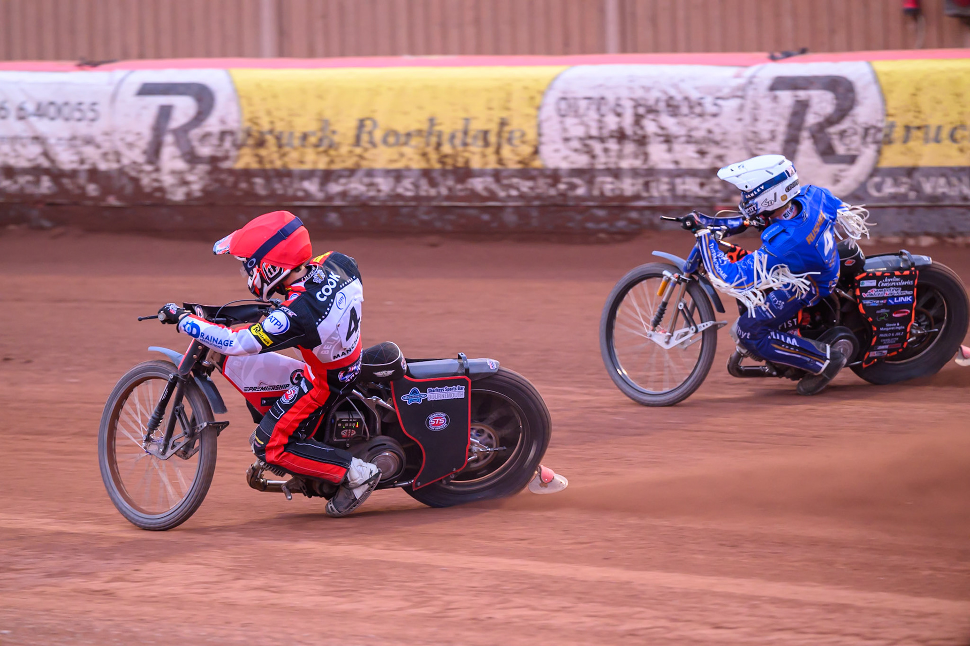 Zach Cook of Belle Vue Aces in Red rides inside Cooper Rushen of Kings Lynn Stars in White  during the Rowe Motor Oil Premiership match between Belle Vue Aces and King's Lynn Stars at the National Speedway Stadium, Manchester on Monday 29th June 2026. (Photo: Ian Charles | MI News)