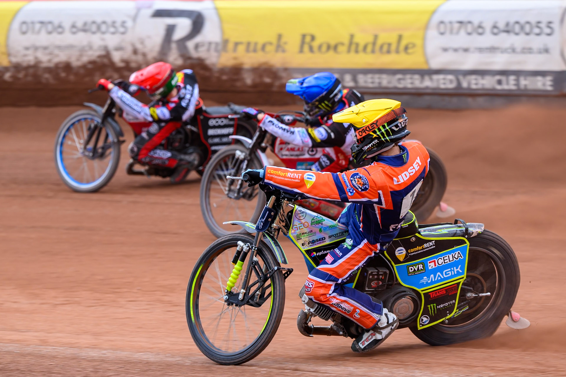 Jaimon Lidsey of Northampton Foxes in Yellow chases Dan Bewley of Belle Vue Aces in Blue and Brady Kurtz of Belle Vue Aces in Red during the Rowe Motor Oil Premiership match between Belle Vue Aces and Northampton Foxes at the National Speedway Stadium, Manchester on Monday 4th May 2026. (Photo: Ian Charles | MI News)