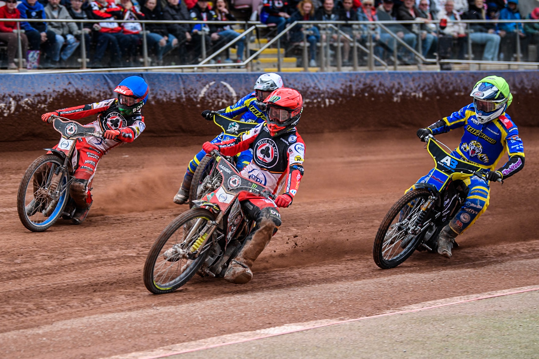 Jaimon Lidsey of Belle Vue Aces in Red leading Brady Kurtz of Belle Vue Aces in Blue Leon Flint of Sheffield Tigers in Yellow and Chris Holder of Sheffield Tigers in White during the Rowe Motor Oil Premiership match between Belle Vue Aces and Sheffield Tigers at the National Speedway Stadium, Manchester on Monday 5th May 2025. (Photo: Ian Charles | MI News)