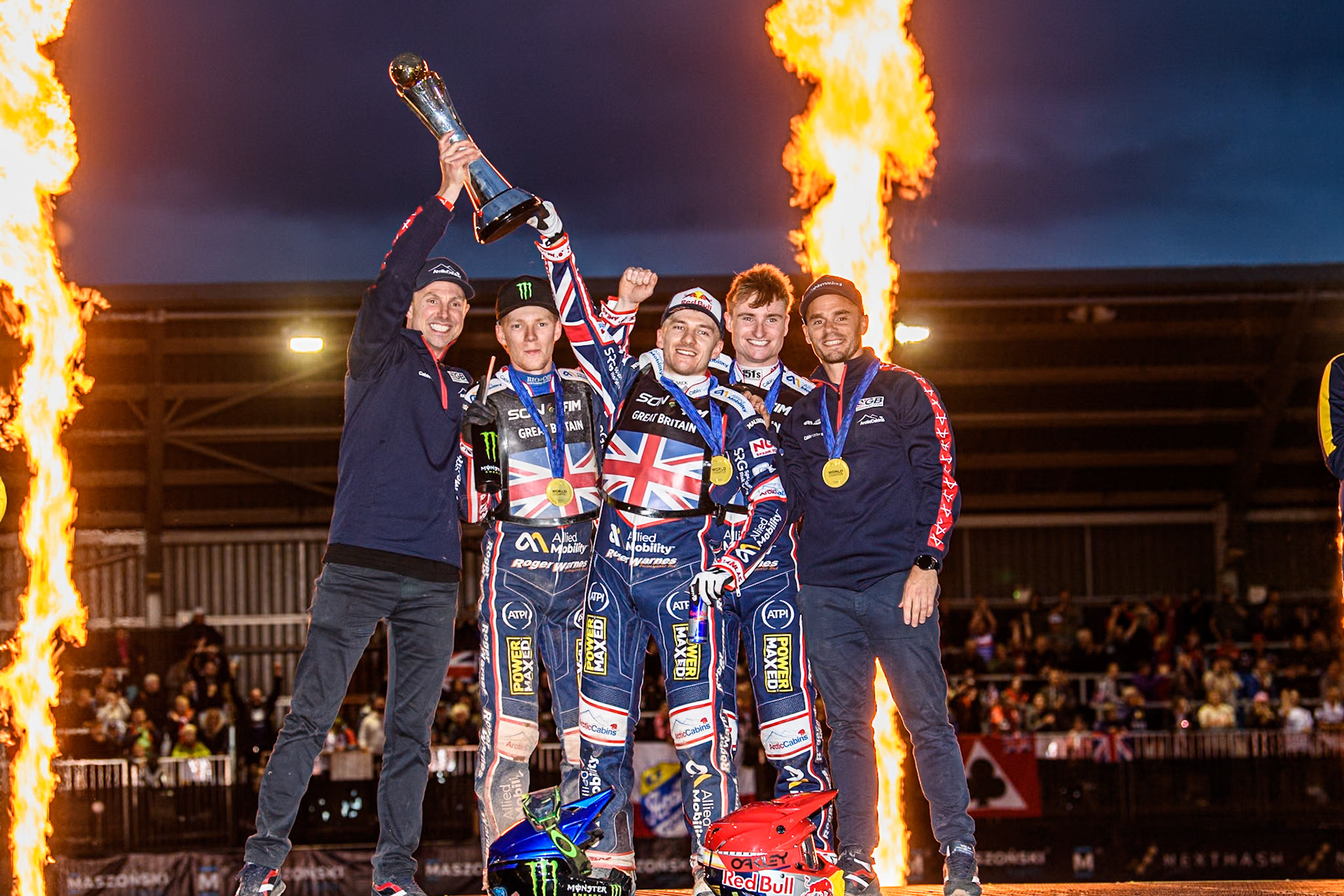 GREAT BRITAIN World Champions: (L to R) British Joint Team manager, Simon Stead, Dan Bewley, Robert Lambert, Tom Brennan, British Joint Team manager, Oliver Allen celebrate winning the trophy during the Monster Energy FIM Speedway of Nation Final at the National Speedway Stadium, Manchester on Saturday 13th July 2024. (Photo: Ian Charles | MI News)