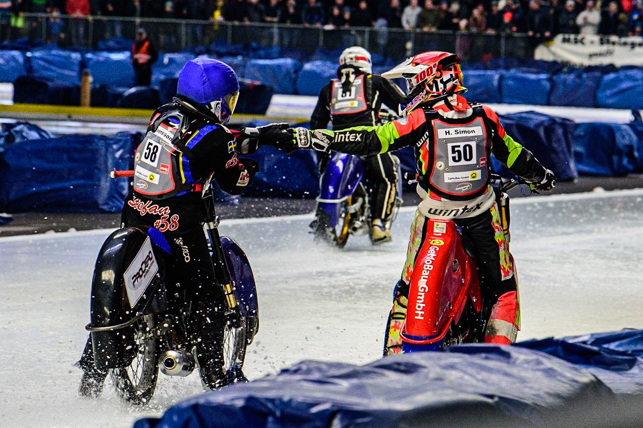 Stefan Svensson (58) congratulates Harald Simon (50) on his heath win during the Ice Speedway Gladiators World Championship Final 2 at Max-Aicher-Arena, Inzell, Germany on Sunday 19th March 2023. (Photo: Ian Charles | MI News)