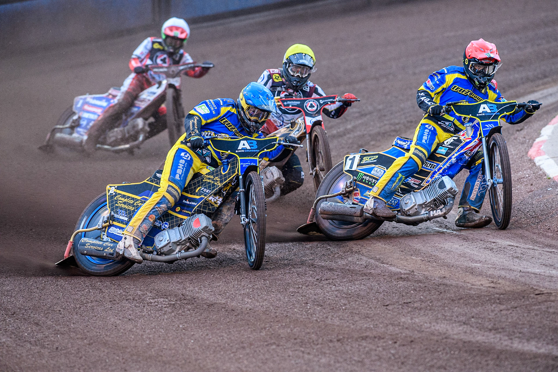 Sheffield Tigers' Kyle Howarth  in Blue and Sheffield Tigers' Jack Holder  in Red leading Belle Vue Aces' Norick Blödorn  in Yellow and Belle Vue Aces' Dan Bewley in White  during the Rowe Motor Oil Premiership match between Sheffield Tigers and Belle Vue Aces at Owlerton Stadium, Sheffield on Monday 26th August 2024. (Photo: Ian Charles | MI News)