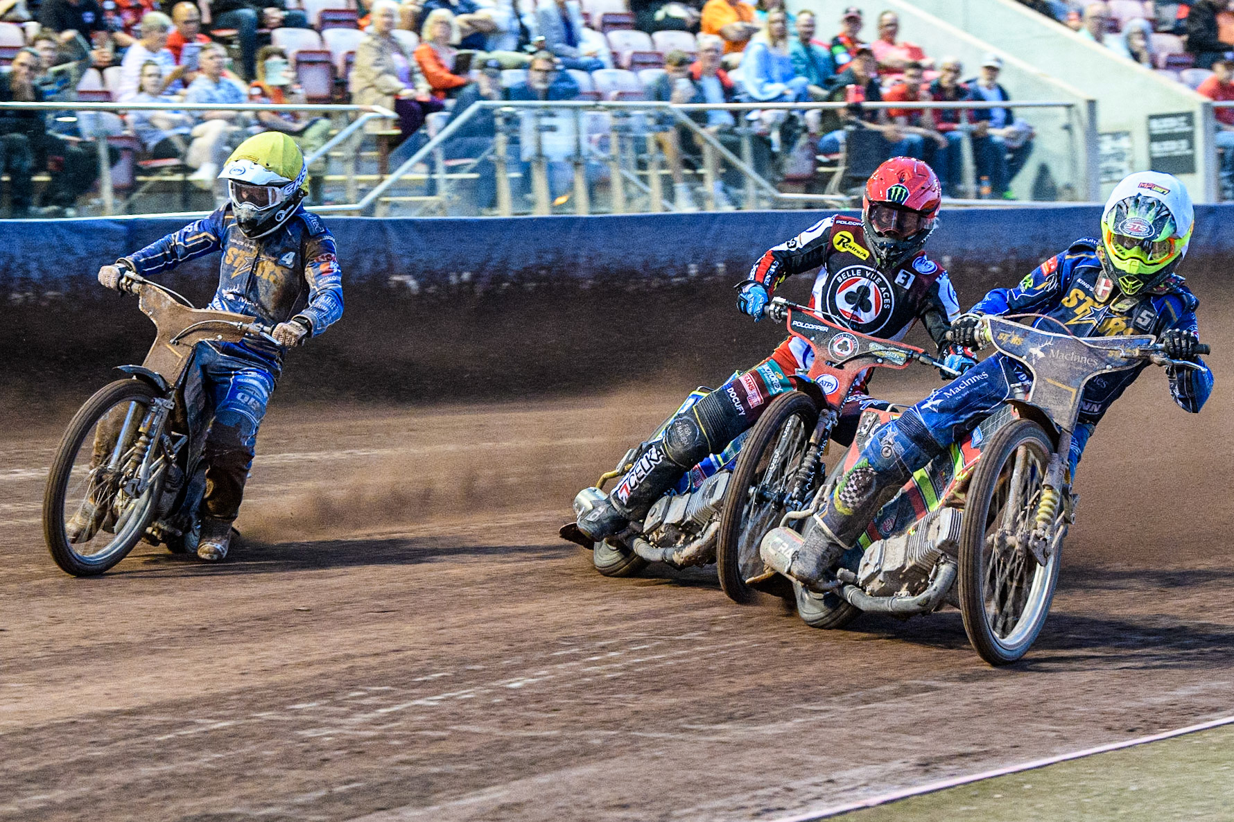 (l - r) Nicolai Klindt (Yellow) Jaimon Lidsey (Red) and Michael Palm Toft (White) during the Sports Insure Premiership match between Belle Vue Aces and King's Lynn Stars at the National Speedway Stadium, Manchester on Monday 12th June 2023. (Photo: Ian Charles | MI News)