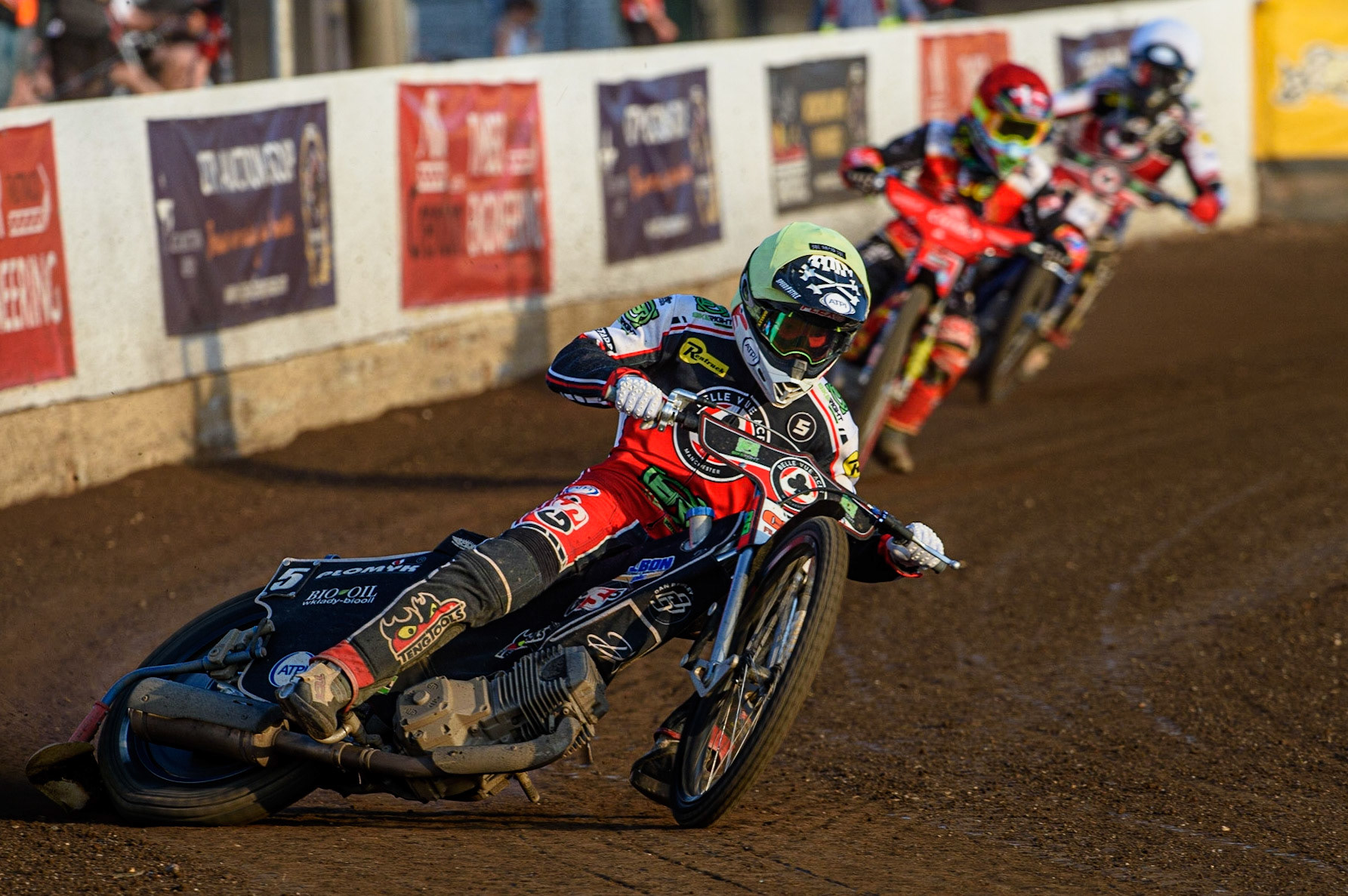 PETERBOROUGH, UK. JULY 19TH   Dan Bewley  (Yellow) on his way to breaking the Peterborough track record as he leads Michael Palm-Toft  (Red) and Brady Kurtz  (White) during the SGB Premiership match between Peterborough and Belle Vue Aces at East of England Showground, Peterborough on Monday 19th July 2021. (Credit: Ian Charles | MI News)