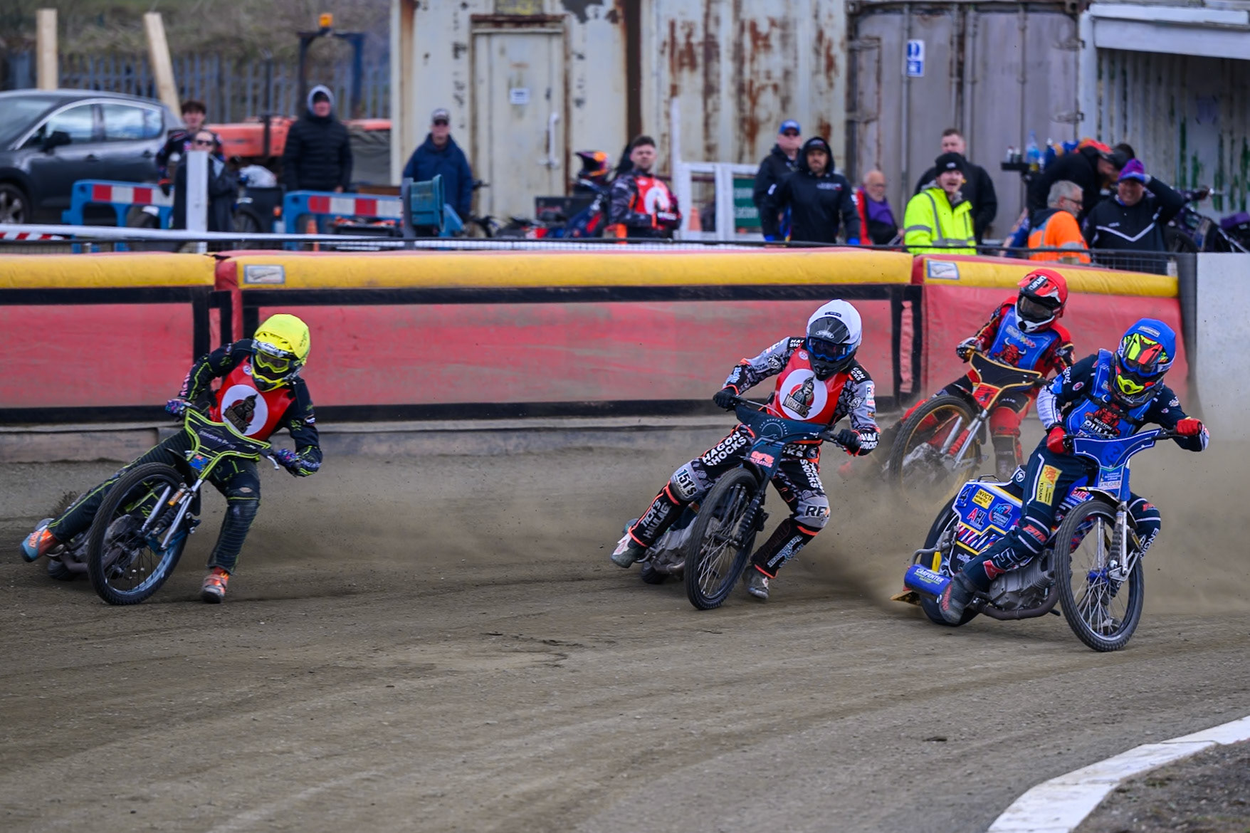 (L to R)Ben Whalley of NDL Nomads  in Yellow, Jack Kingston of NDL Nomads    in White, Jamie Etherington of Buxton Bulls  in Blue with Luke Harris of Buxton Bulls   in Red behind during the  Challenge match between Buxton Bulls and NDL Nomads at Hi-Edge Speedway, Buxton on Sunday 19th April 2026. (Photo: Ian Charles | MI News)