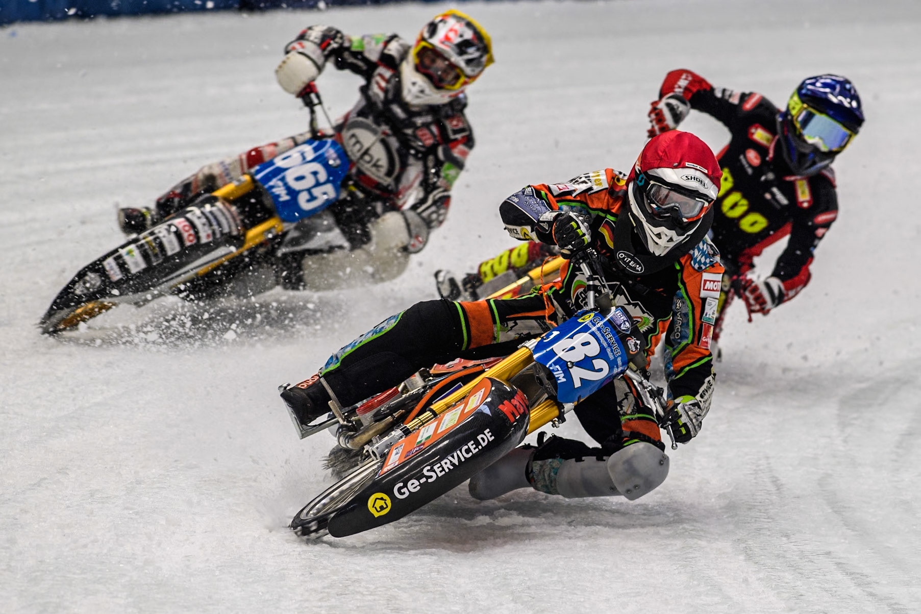 Germany's Markus Jell (82) (Red) leads  Austria's Charly Ebner (665) (Yellow) and Netherlands' Jasper Iwema (800) (Blue) during the FIM Ice Speedway Gladiators World Championship Final 2 at the Max-Aicher-Arena, Inzell on Sunday 24 March 2024. (Photo: Ian Charles | MI News)