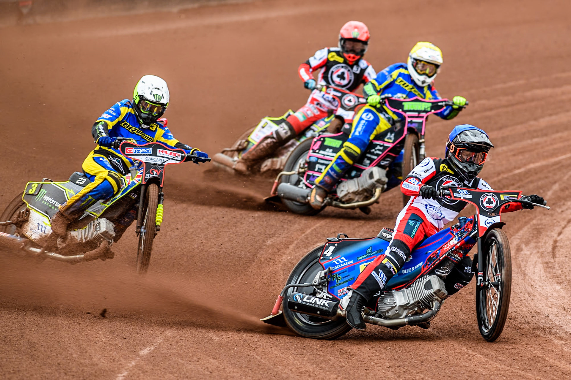 Belle Vue ATPI Aces Ben Cook (Blue) leads  Sheffield Tigers' Chris Holder (White), Sheffield Tigers' Josh Pickering (Yellow) and Belle Vue ATPI Aces Jaimon Lidsey (Red) during the Rowe Motor Oil Premiership KO Cup Quarter Final 1st Leg between Belle Vue Aces and Sheffield Tigers at the National Speedway Stadium, Manchester on Monday 1st April 2024. (Photo: Ian Charles | MI News)