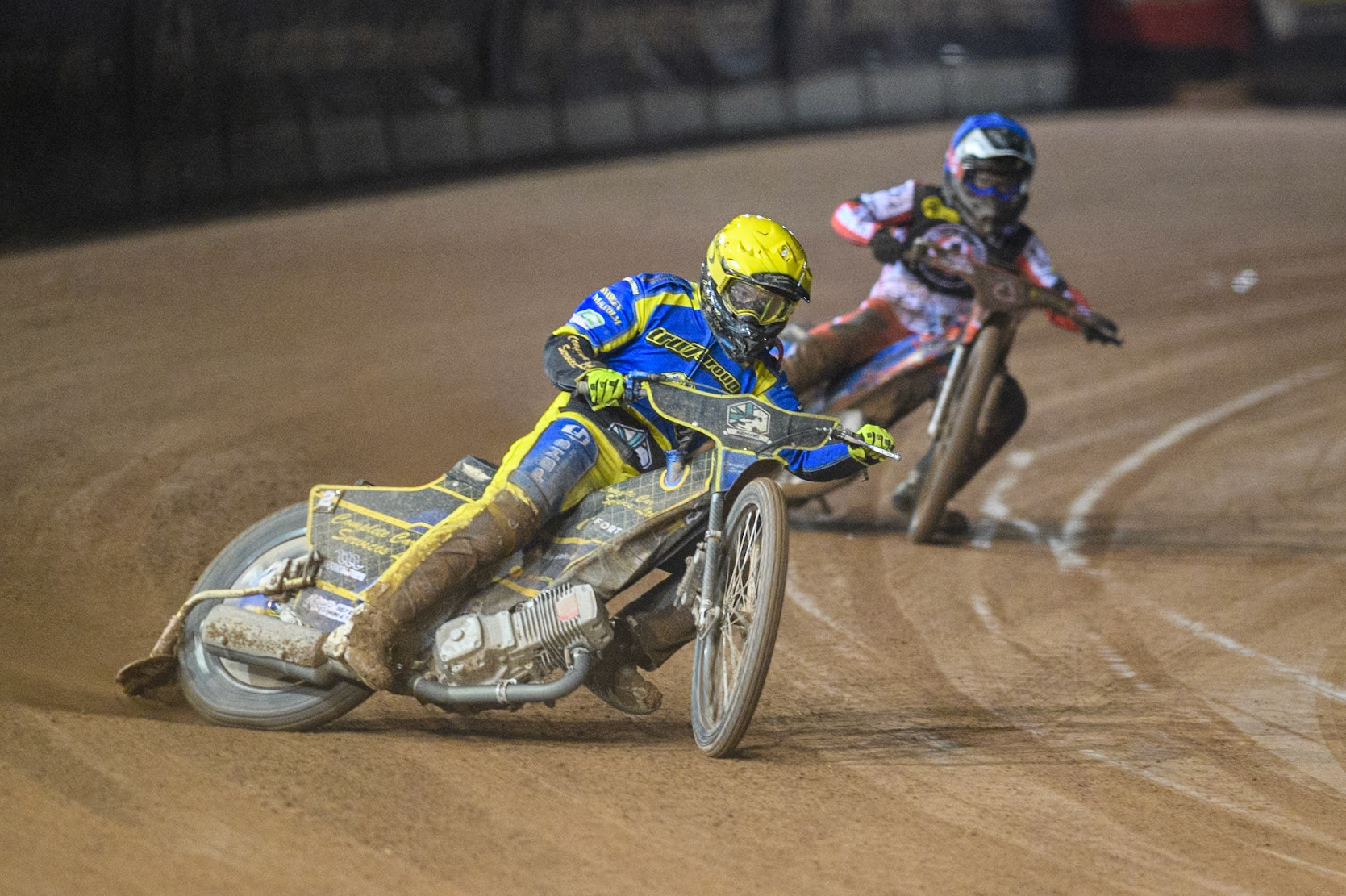 Sheffield Tigers' Kyle Howarth  in Yellow leading Belle Vue Aces' Ben Cook  in Blue during the Rowe Motor Oil Premiership Play Off Semi Final 2, 1st Leg match between Belle Vue Aces and Sheffield Tigers at the National Speedway Stadium, Manchester on Monday 16th September 2024. (Photo: Ian Charles | MI News)