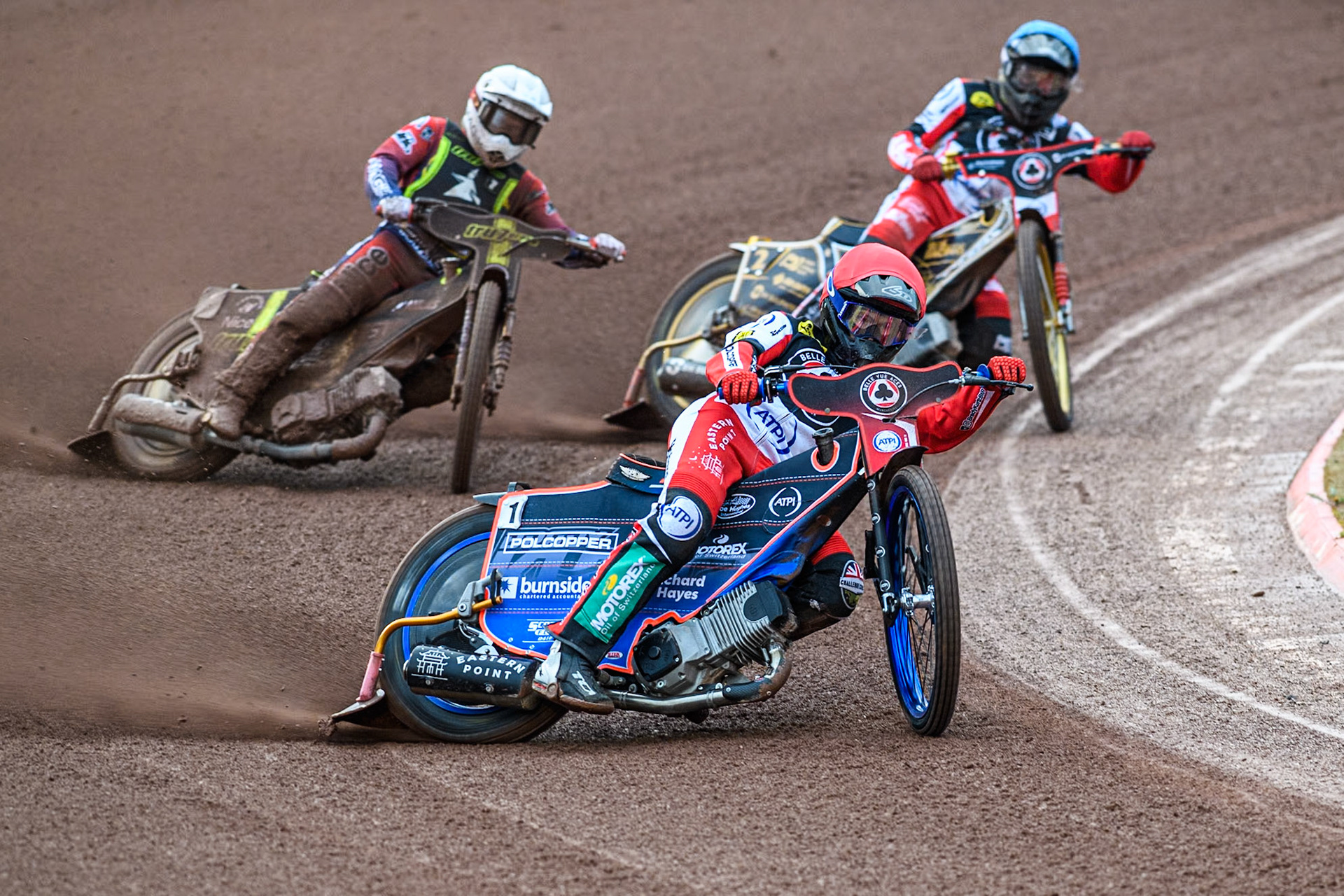 Belle Vue Aces' Brady Kurtz in Red leading Ipswich Witches' Emil Sayfutdinov in White and Belle Vue Aces' Norick Blödorn in Blue during the Rowe Motor Oil Premiership match between Belle Vue Aces and Ipswich Witches at the National Speedway Stadium, Manchester on Monday 22nd April 2024. (Photo: Ian Charles | MI News)
