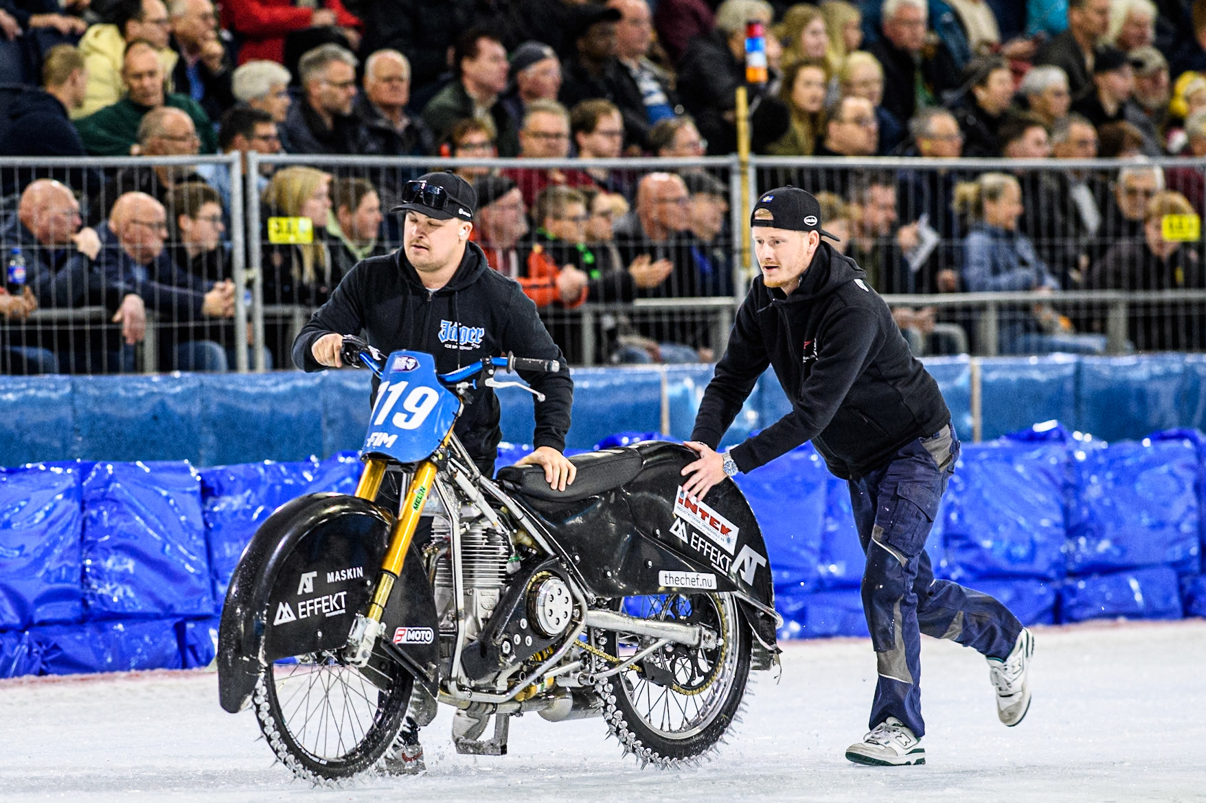 Filip Jäger’s mechanics push his bike back to the pits after his fall  during the FIM Ice Speedway Gladiators World Championship, Final 4 at the Ice Stadium, Thialf, Heerenveen on Sunday 6th April 2025. (Photo: Ian Charles | MI News)