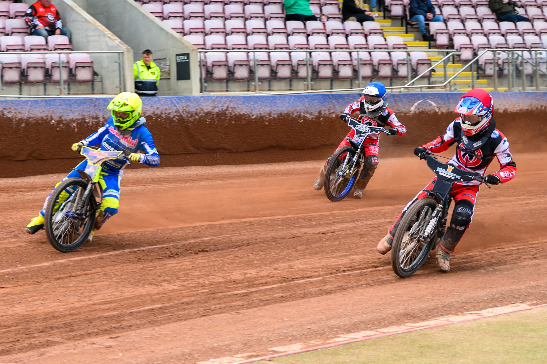 Belle Vue Colts' Freddy Hodder  in Red rides inside Oxford Chargers' Jacob Clouting  in Yellow with Belle Vue Colts' Jack Shimelt  in Blue behind during the WSRA National Development League match between Belle Vue Colts and Oxford Chargers at the National Speedway Stadium, Manchester on Sunday 1st June 2025. (Photo: Ian Charles | MI News)