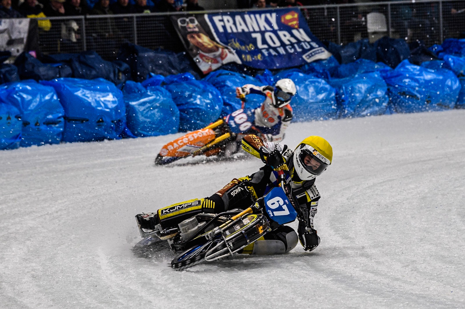 Heikki Huusko (67) of Finland in Yellow leading Jasper Iwema (800) of The Netherlands in White during the Ice Speedway Gladiators World Championship Final 2 at Max-Aicher-Arena, Inzell on Sunday 16th March 2025. (Photo: Ian Charles | MI News)