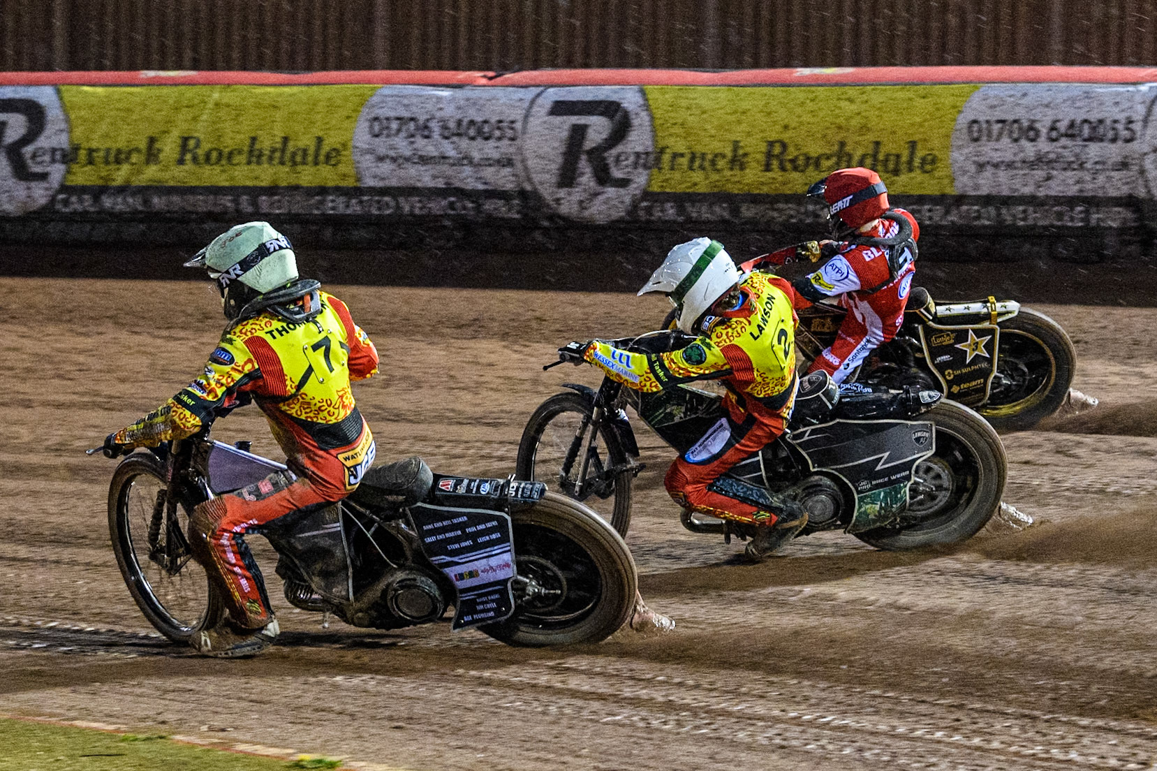Joe Thompson of Leicester Lions in Yellow and Richard Lawson of Leicester Lions in White rides inside Norick Blödorn of Belle Vue Aces in Red during the Rowe Motor Oil Premiership match between Belle Vue Aces and Leicester Lions at the National Speedway Stadium, Manchester on Saturday 6th April 2024. (Photo: Ian Charles | MI News)