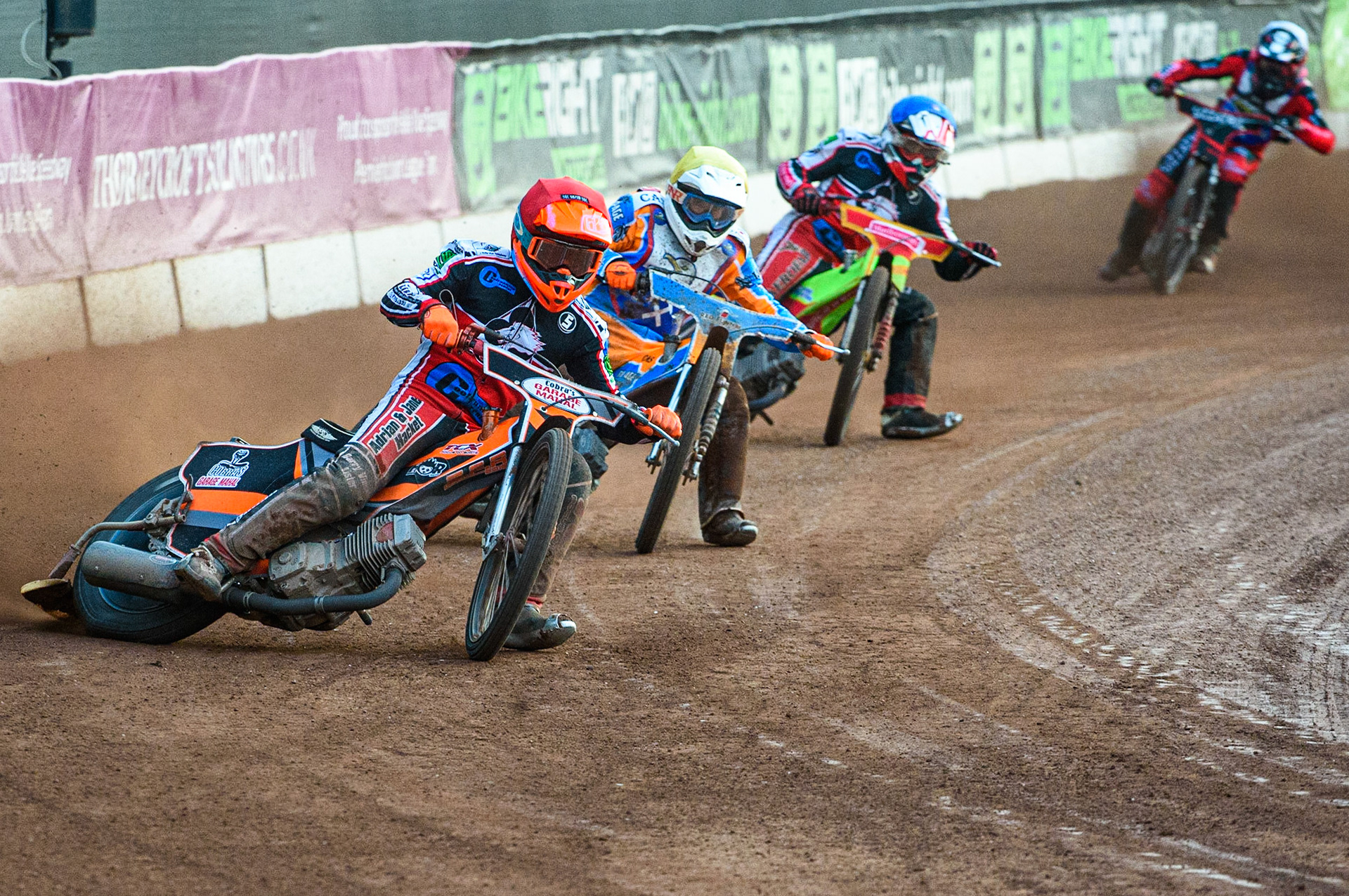 MANCHESTER, UK. JULY 23RD  Connor Coles  (Red) leads Danno Verge  (Yellow) and Ben Woodhull  (Blue) with Joe Alcock (White) behind during the National Development League match between Belle Vue Colts and Eastbourne Seagulls at the National Speedway Stadium, Manchester on Friday 23rd July 2021. (Credit: Ian Charles | MI News)