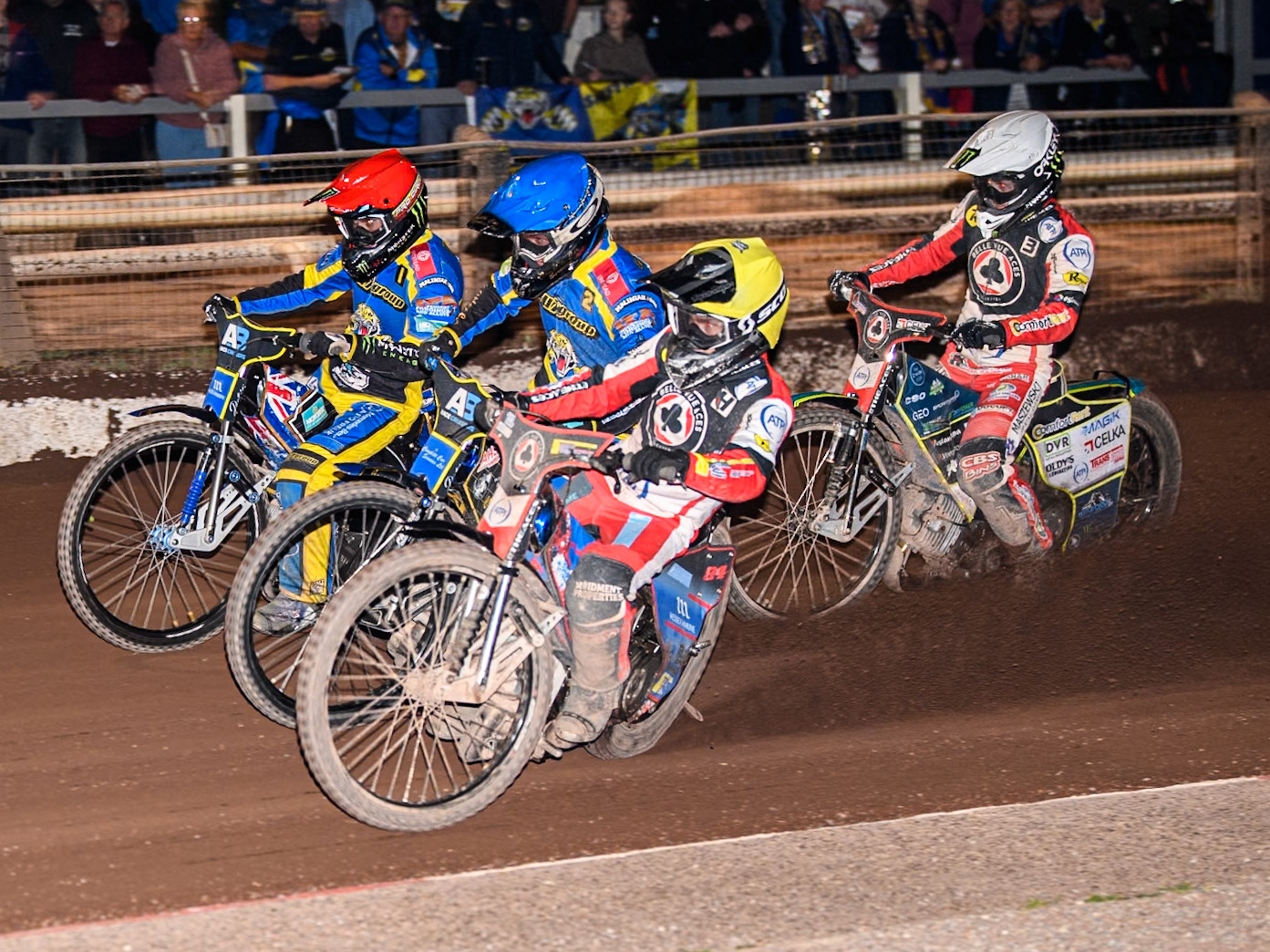 Belle Vue Aces' Ben Cook  in Yellow rides inside Sheffield Tigers' Kyle Howarth  in Blue and Sheffield Tigers' Jack Holder in Red with Belle Vue Aces' Jaimon Lidsey  in White behind during the Rowe Motor Oil Premiership match between Sheffield Tigers and Belle Vue Aces at Owlerton Stadium, Sheffield on Monday 26th August 2024. (Photo: Ian Charles | MI News)