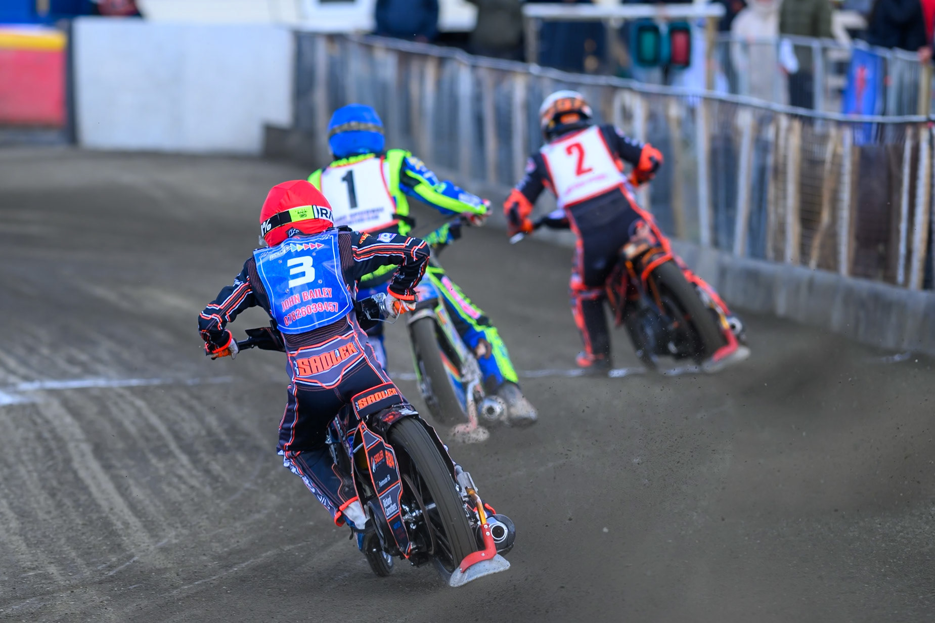 Jacob Fellows of Buxton Bulls  in Red chases Simon Lambert of 'The Potters'  in Blue and Alex Spooner of 'The Kings'  in White during the Regina Chains Fours at Buxton Speedway, Buxton on Sunday 5th April 2026. (Photo: Ian Charles | MI News)