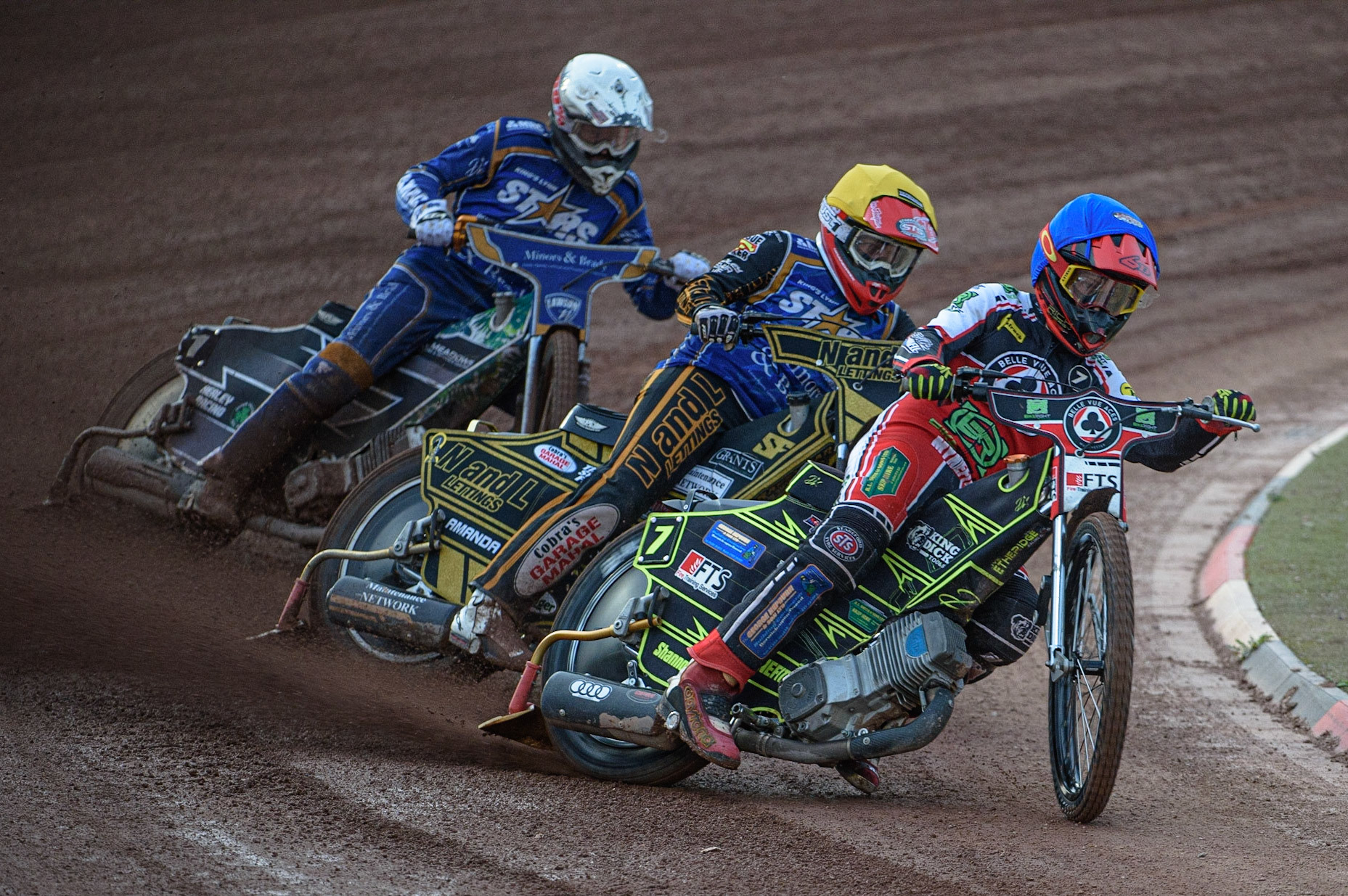 MANCHESTER, UK. AUGUST 23RD    Jye Etheridge  (Blue) leads Ben Barker  (Yellow) and Richard Lawson (White) during the SGB Premiership match between Belle Vue Aces and King's Lynn Stars at the National Speedway Stadium, Manchester on Monday 23rd August 2021. (Credit: Ian Charles | MI News)
