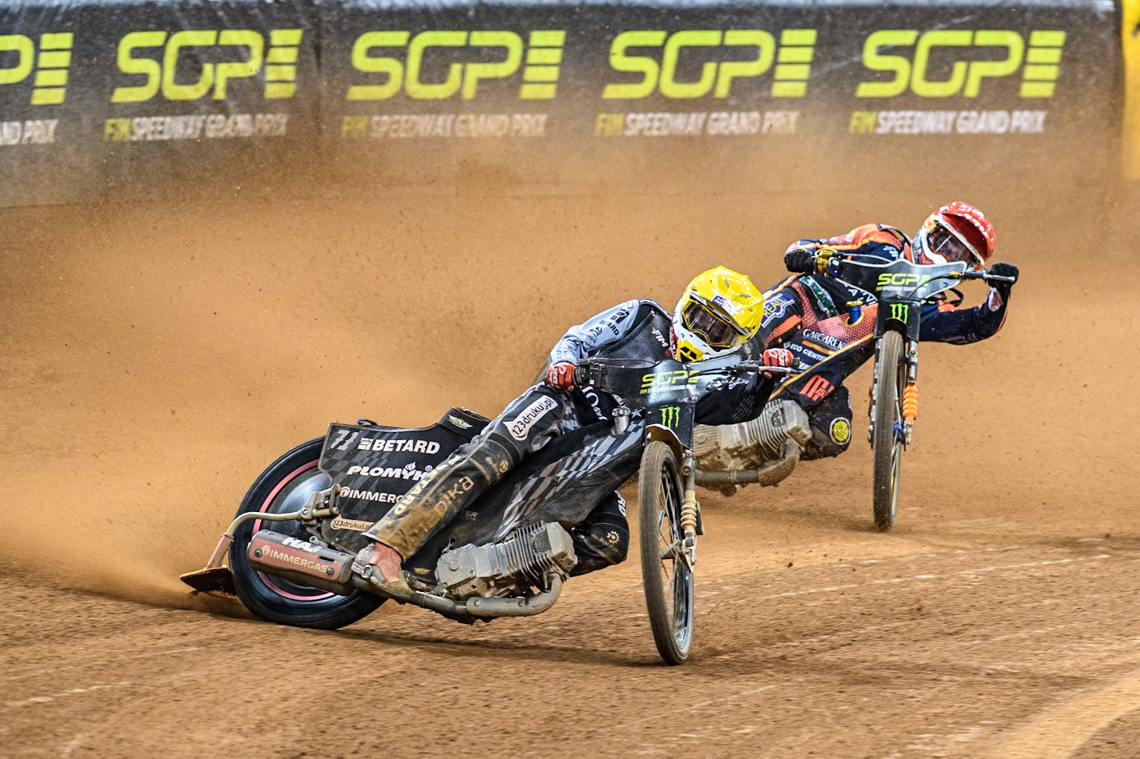 Maciej Janowski (71) of Poland in Yellow leading Mikkel Michelsen (155) of Denmark in Red during the FIM Speedway Grand Prix of Great Britain at The Principality Stadium, Cardiff on Saturday 17th August 2024. (Photo: Ian Charles | MI News)